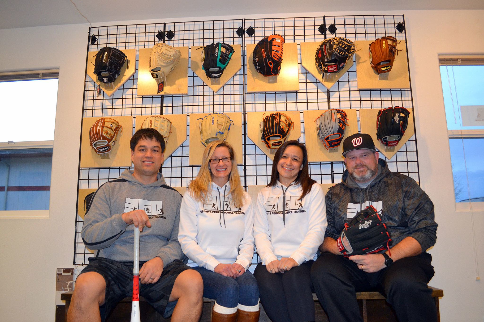 John Qualls, Lisa Jones, Diana Thompson-Young and Chris Young co-own 360 Sporting Goods, which offers high-quality equipment for baseball and softball players that they can try out. Sequim Gazette photos by Matthew Nash