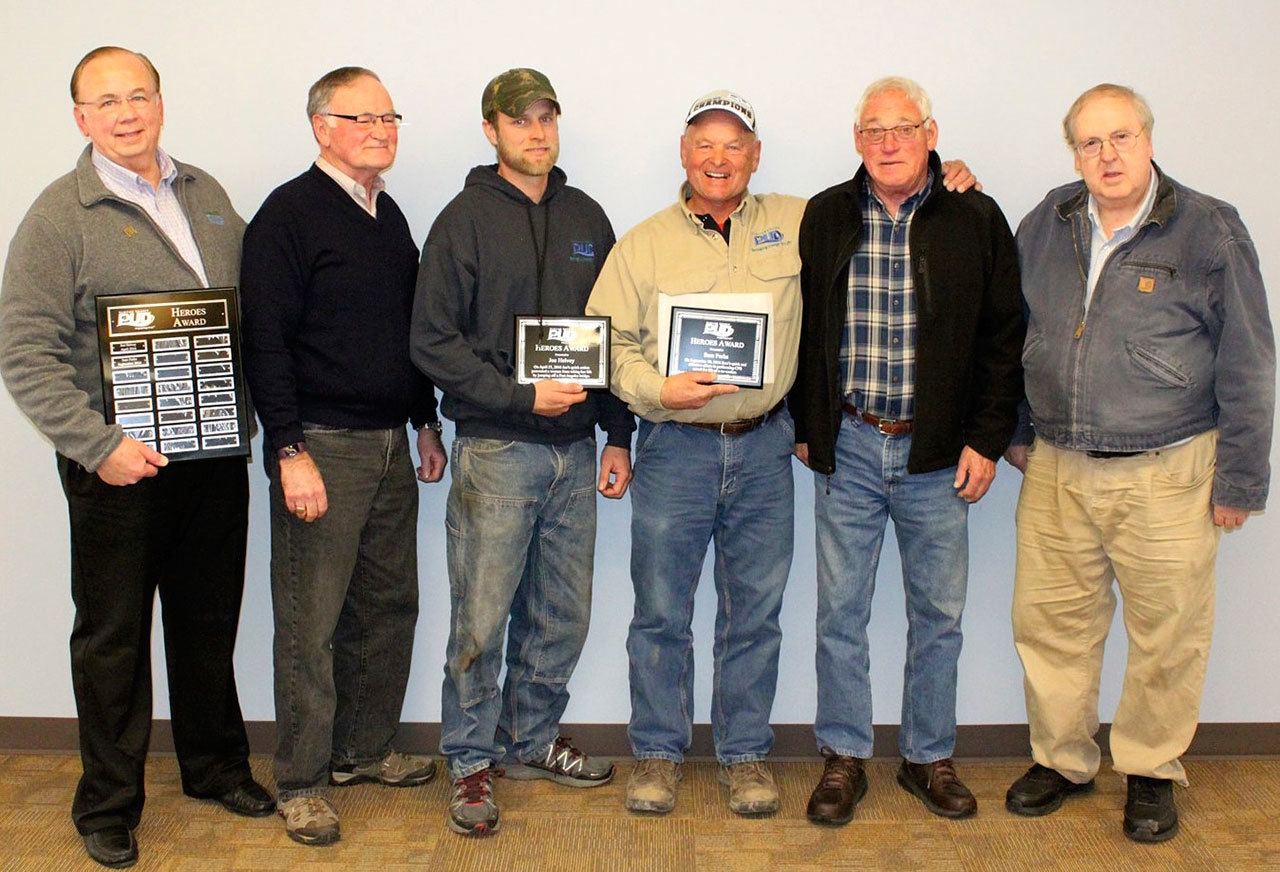 Pictured, from left, are Clallam PUD General Manager Doug Nass, Commissioner Will Purser, honorees Joe Helvey and Sam Parks, Commissioner Ted Simpson and Commissioner Hugh Haffner. Submitted photo