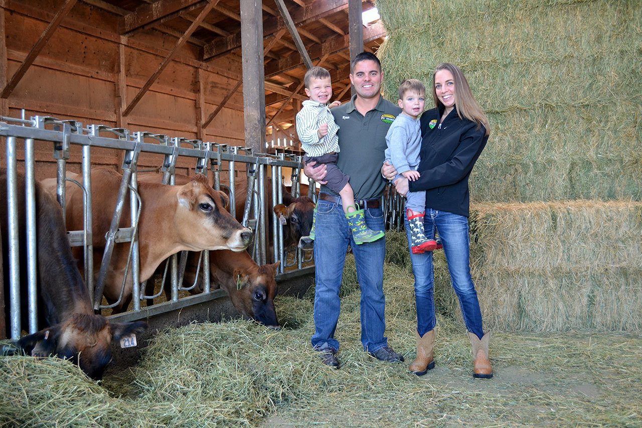 Husband and wife Ryan and Sarah McCarthey with their boys Tyler and Wade plan to use a USDA matching grant to grow their business by hiring a new staffer to conduct product samplings of their raw milk products over the next three years. Sequim Gazette photo by Matthew Nash