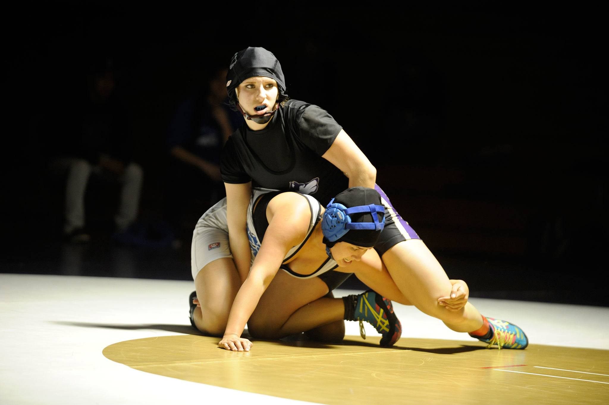 Sequim’s Megan Puksta considers her next move in a match-up at 120 pounds with North Mason’s Marissa Covarrubias, who went on to win 14-13. Sequim Gazette photo by Matthew Nash