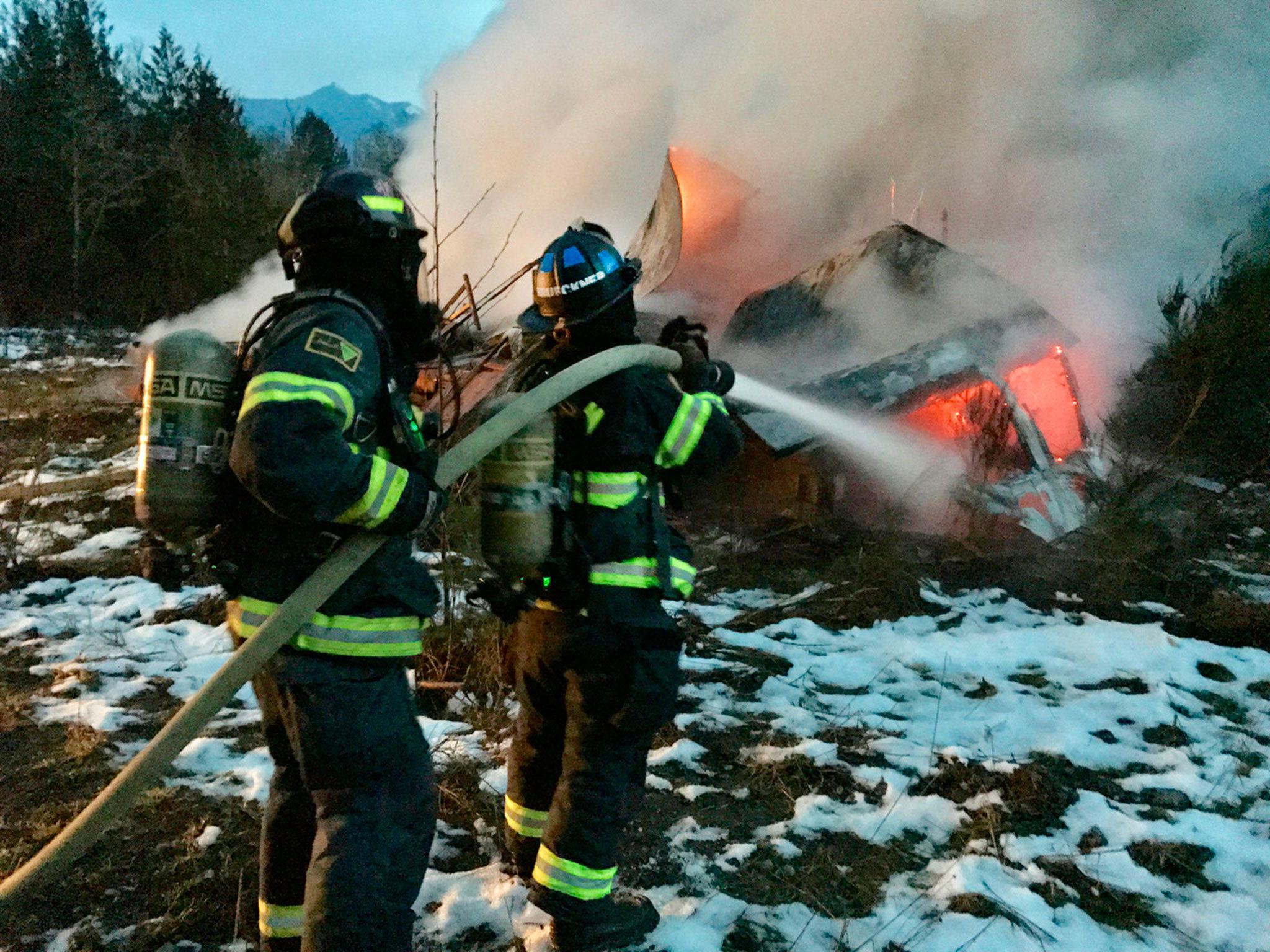 Fire engulfs structure at the old Clallam Timber log yard