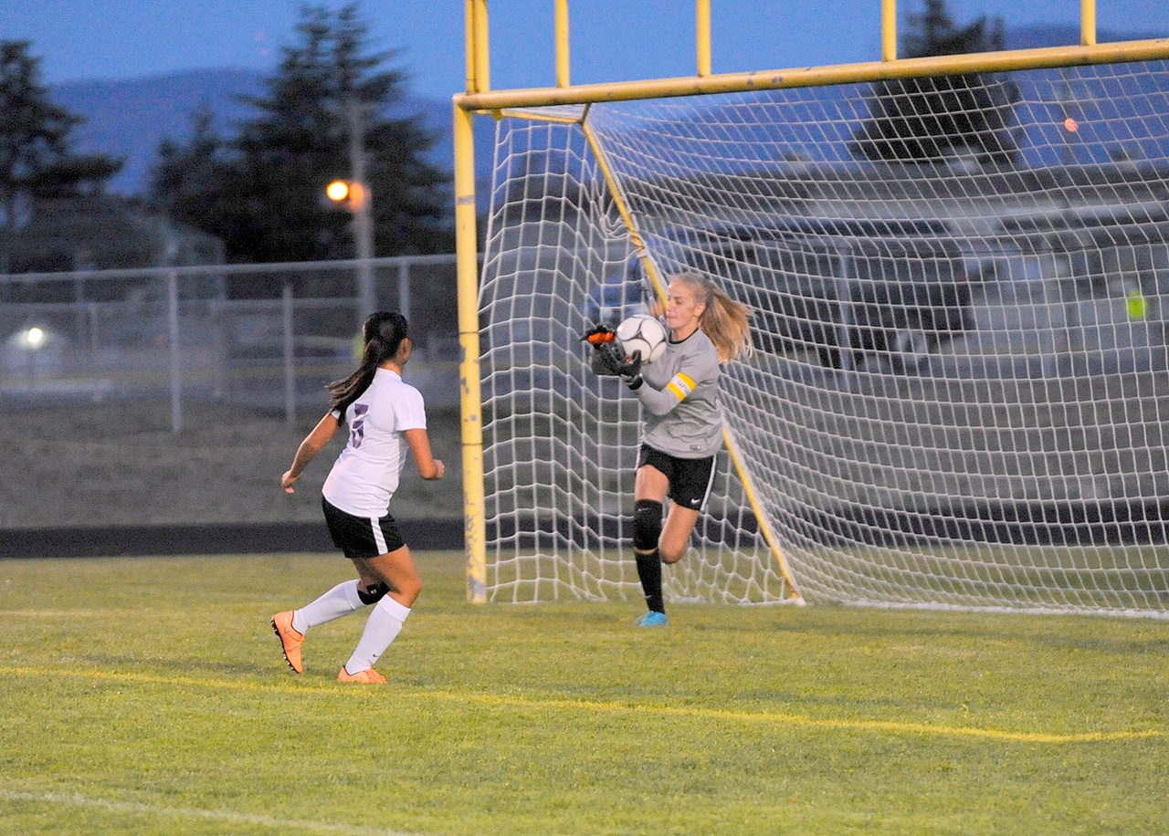 Sequim Gazette file photo by Matthew Nash                                Matthew Nash/Olympic Peninsula News Group Sequim’s Claire Henninger (with ball) makes a save during an early-season contest.