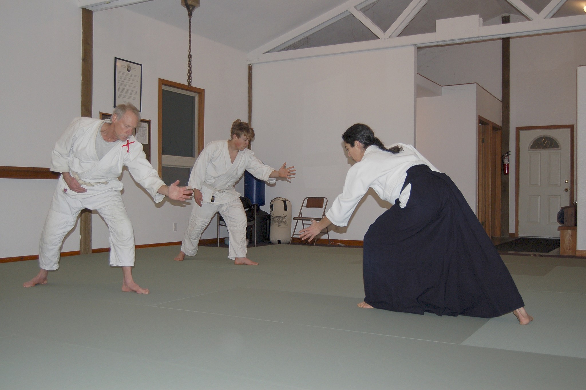 Chief Aikido instructor Neilu Naini leads her students Andy Brastad, left, and William Jevne, right, during a warm-up exercise at the Aikido Dojo off Carlsborg Road in Sequim. Sequim Gazette photos by Erin Hawkins