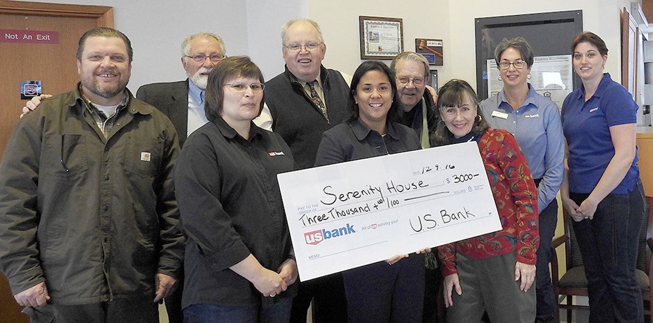 Serenity House board members and staff receive a grant from U.S. Bank Foundation to help Clallam County residents overcome homelessness. Pictured from left are (front row) Carlyne Littlejohn of US Bank and Serenity House business manager Kathy Allen and board member Sally Franz; and (back row) Serenity House operations director Kevin Harkins, board president Scott Schaefer, Executive Director Richard “Doc” Robinson, and board member Mike McEvoy, and US Bank manager Lisa Meyer and sales & service manager Andrea Thompson. Submitted photo