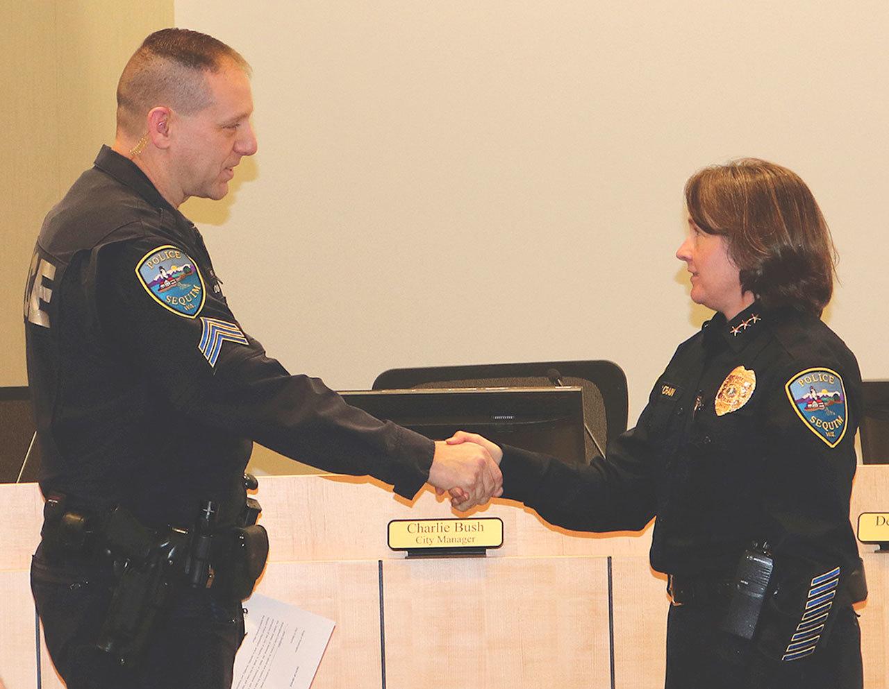 Sequim Police Chief Sheri Crain congratulates Sergeant John Southard during his swearing-in ceremony on Jan. 30. Submitted photo