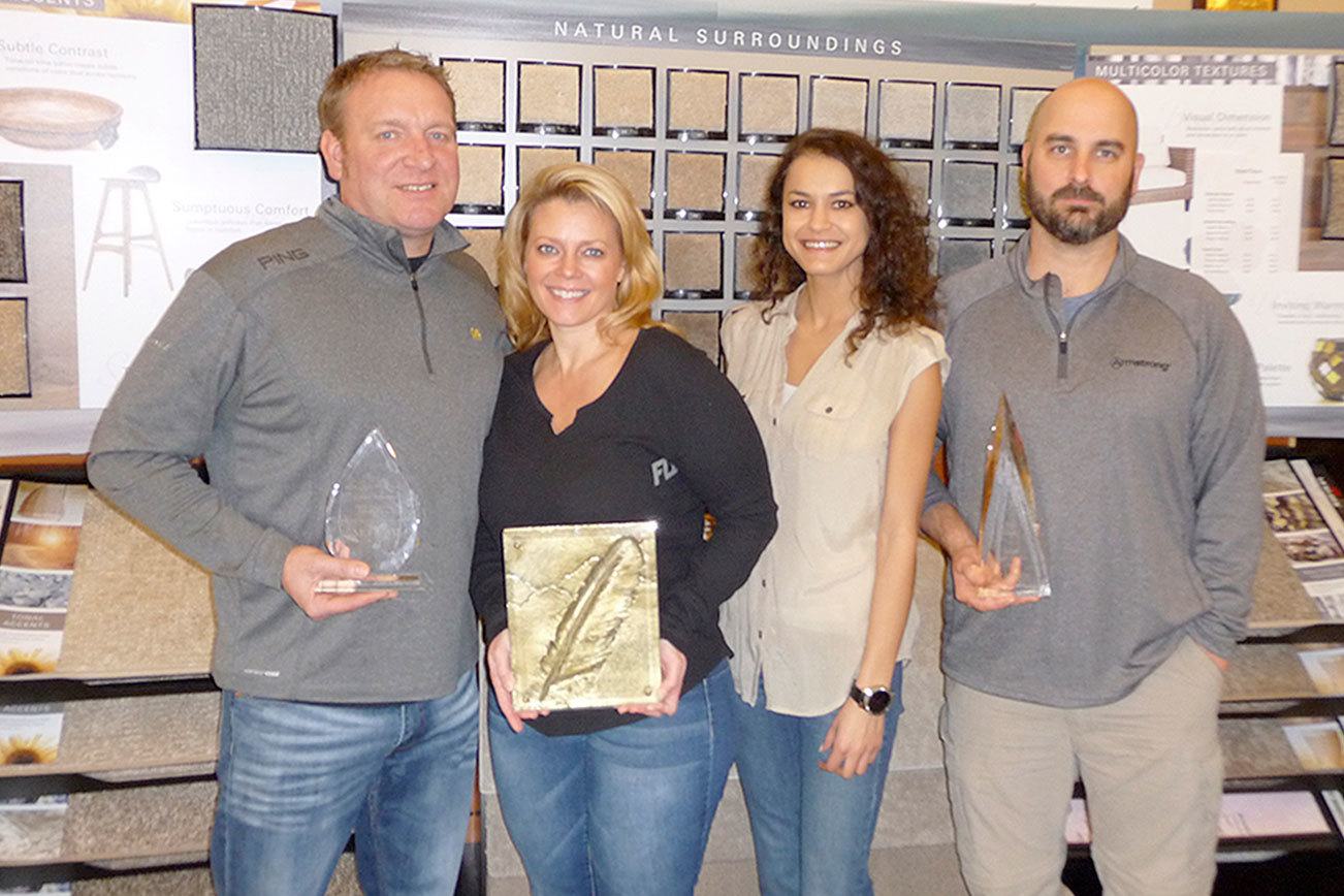 Strait Floors is proud to have earned the prestigious 2016 National Dealer of the Year and other awards. From left are owners Steve and Hayley Wilson, interior designer Keli Haffner and owner Chad Copeland. Sequim Gazette photo by Patricia Morrison Coate