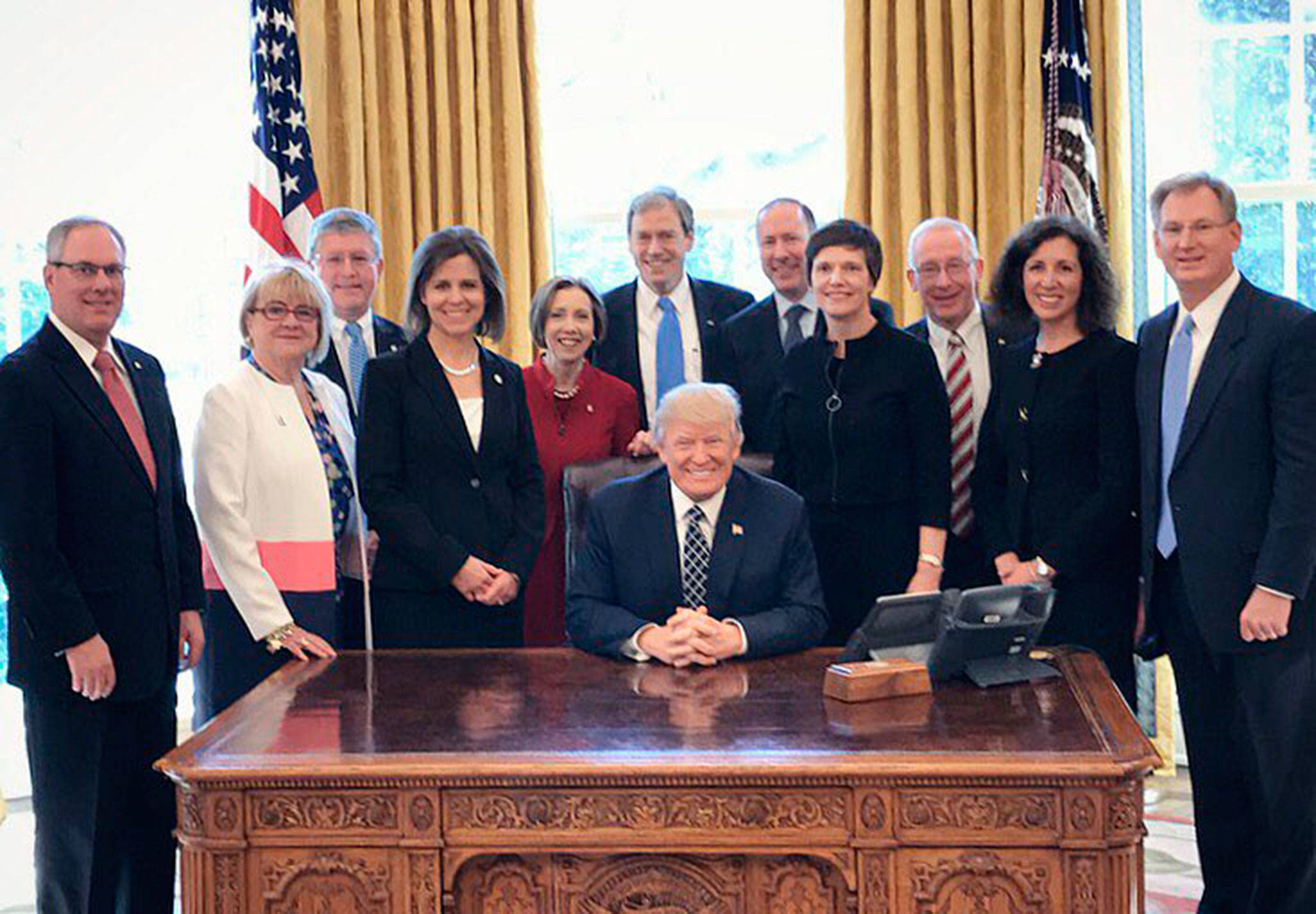 Sound Community Bank president/CEO Laurie Stewart (second from left) joins other community bank representatives at the White House on March 9. Submitted photos