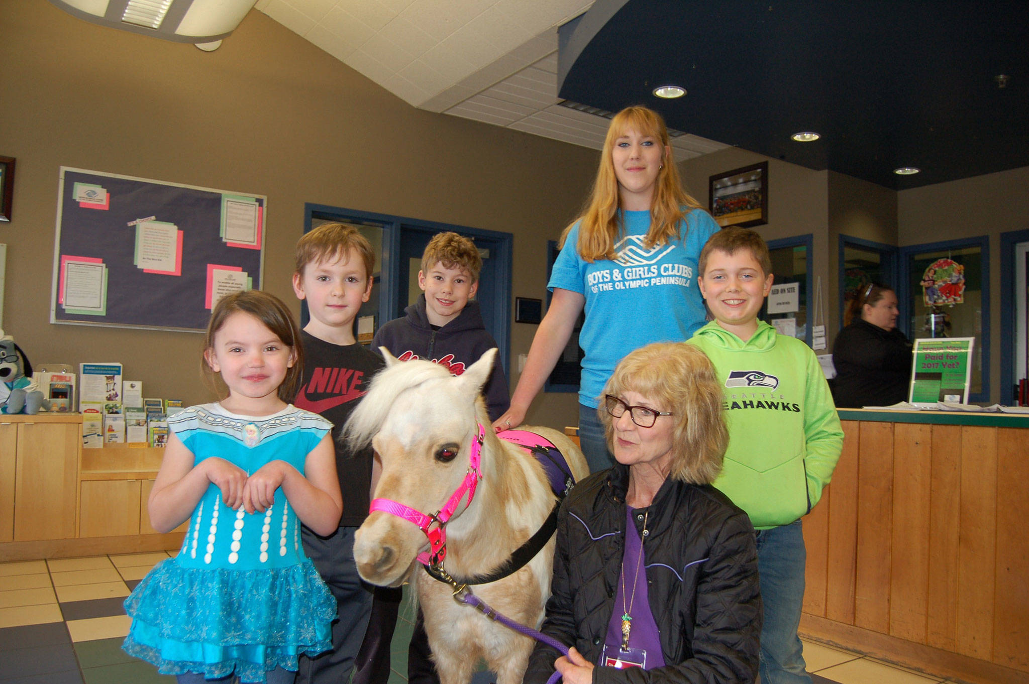 Minaiture therapy horse visits youth