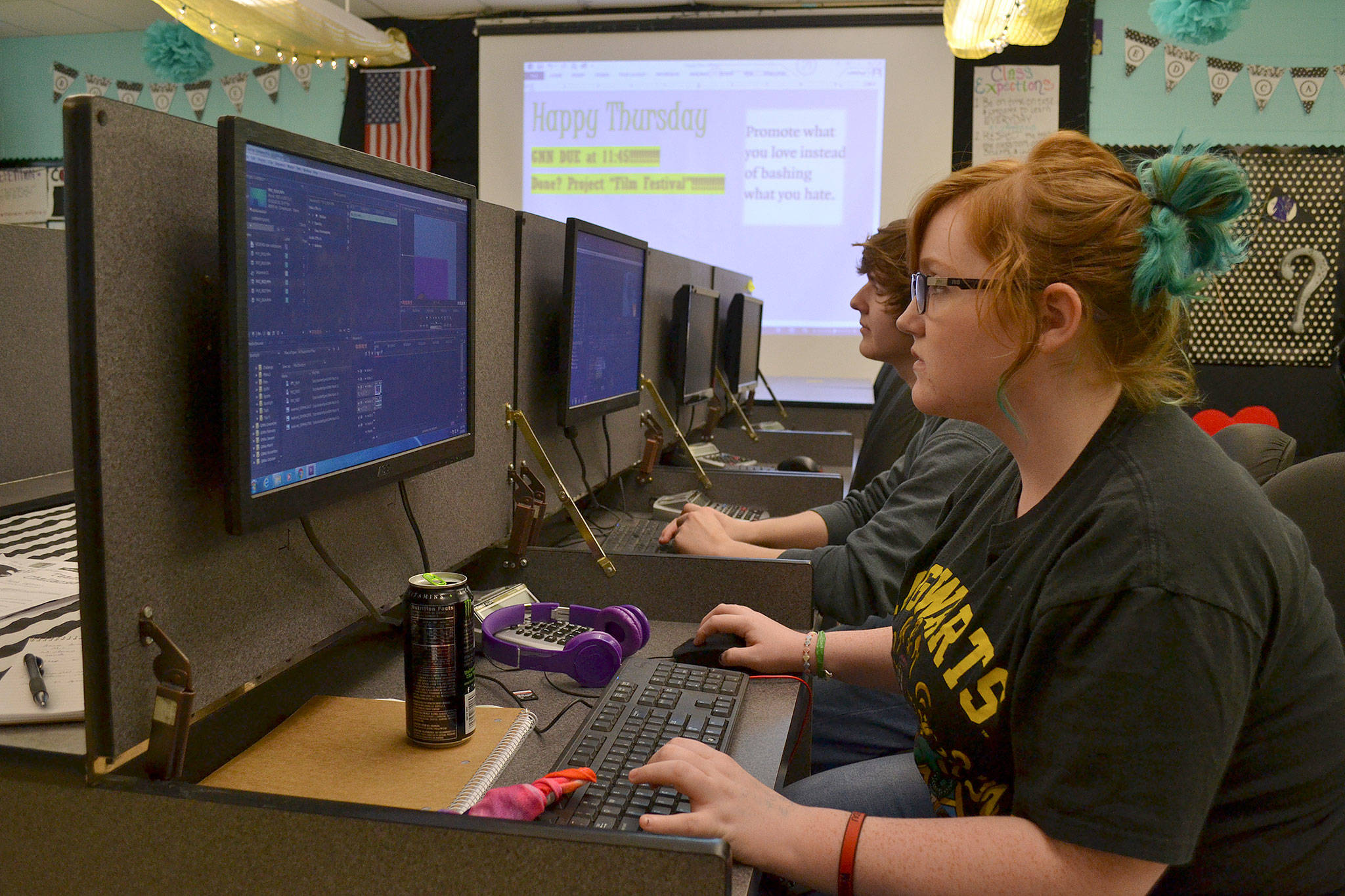 Abygail Mundy and Atticus Wickert work on video segments in their video production class at Sequim High School. Both are considering entering films for the 12th Student Film Festival at the school on April 21. Deadline to enter is April 10 for students grades 6-12. Sequim Gazette photos by Matthew Nash