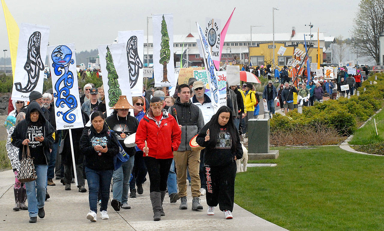 A line of more than 400 marchers make their way through West End Park on the Port Angeles waterfront Saturday to raise awareness of climate change and to promote good stewardship of the environment. Keith Thorpe/Peninsula Daily News