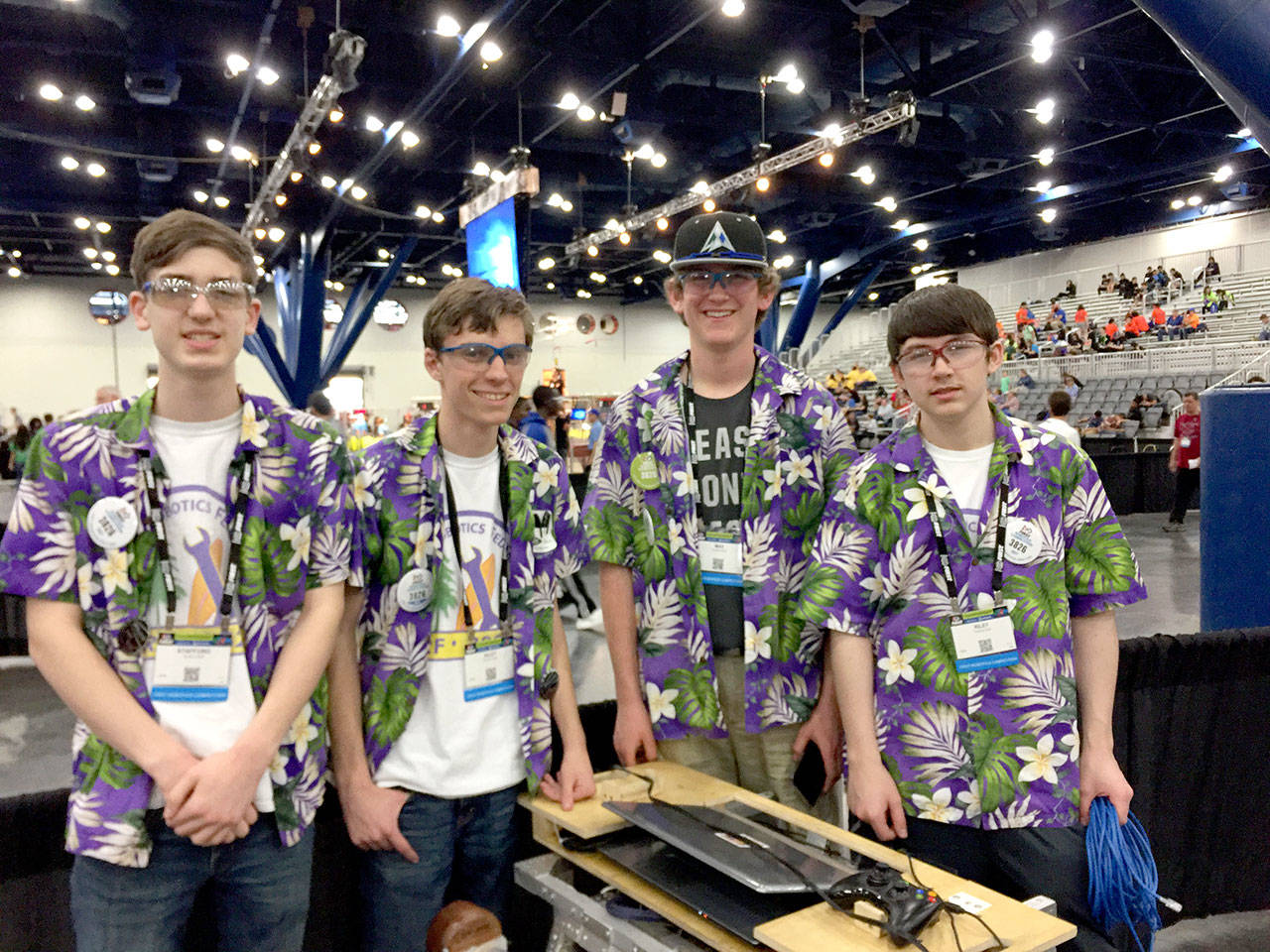 Sequim robotics team members pilot Xavier Stafford, coach Riley Scott, Max Koonz and driver and team captain Riley Chase, from left, after their district’s matches in Auburn. (Sequim High School)