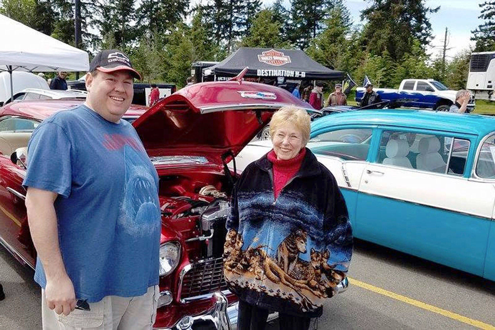 Norma and Mike Garcia Jr. picked the 1955 Chevy to win the Mike Garcia most photogenic award at the Hot Rods & Harleys Show n’ Cruz on May 13. Garcia Sr. died from pancreatic cancer about a month ago and was a well-loved member of the car community. Participants in the show traveled the Grand Parade route and parked at Sequim Walmart. Photo courtesy of Randy Perry
