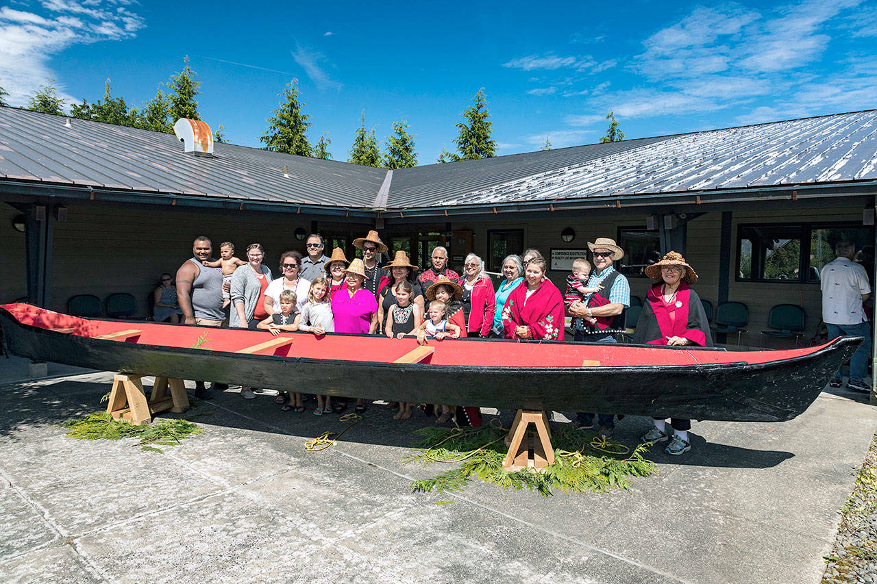 Viola Penn Riebe, center, flanked by children, welcomed home with family and friends the Viola canoe during a ceremony at the Olympic Natural Resources Center in Forks. (Michael McNerney)
