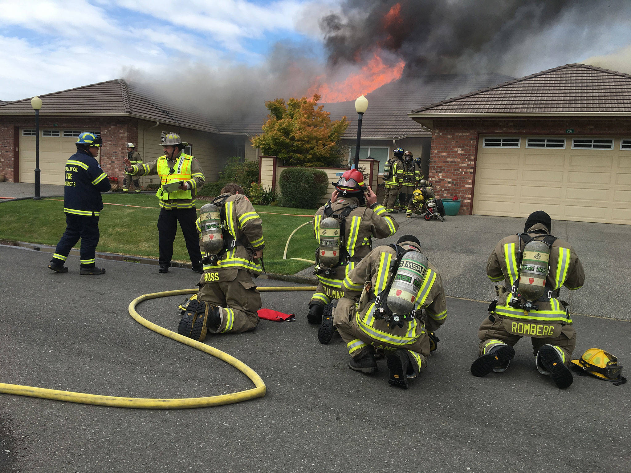 Fire crews with Clallam County Fire District 3 ready to enter a duplex fire on July 20 in Sunland North. The fire was reported to 9-1-1 around 4 p.m. Thursday but a cause has not been determined as of July 21. Sequim Gazette photos by Matthew Nash
