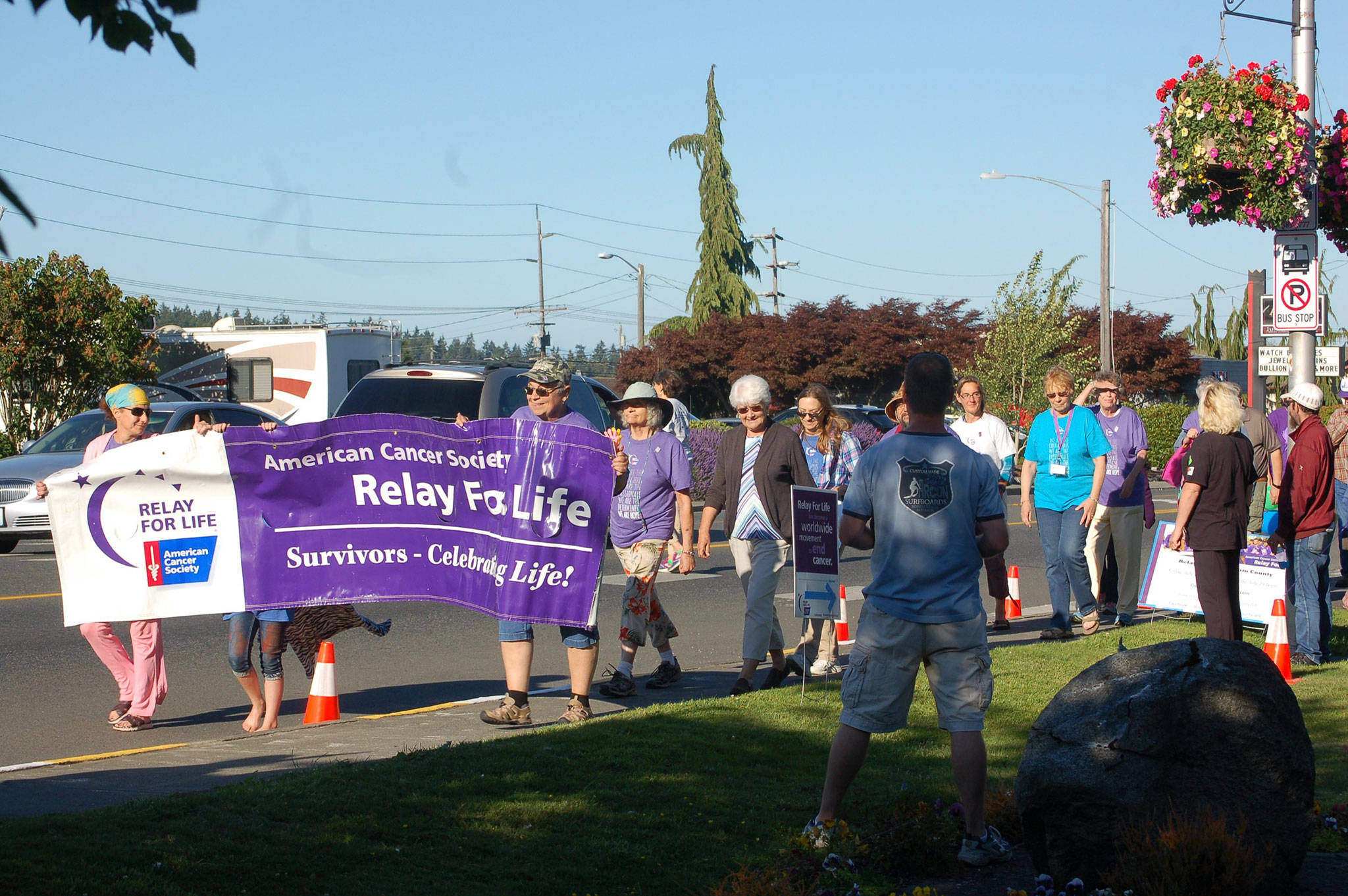 Participants in the American Cancer Society’s Relay for Life Clallam County walked around Pioneer Memorial Park in Sequim to kick off the annual ceremony on Friday, July 28. Sequim Gazette photo by Erin Hawkins