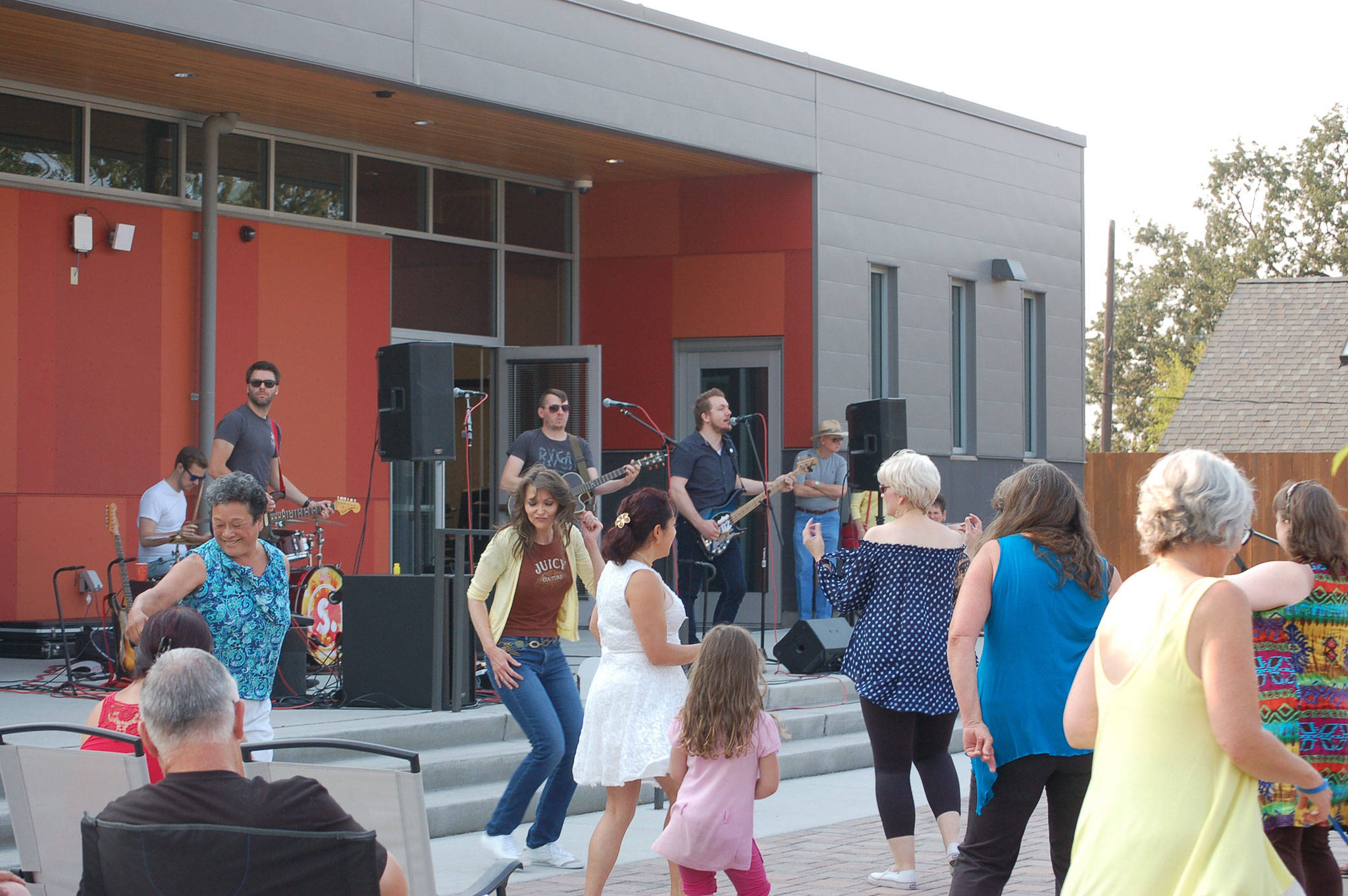 A group dances to live music from the Seattle-based band Shaggy Sweet at the Keying Around block party on Friday, Aug. 4. The event featured a painted piano auction, live music, food from Maggie Mays food truck and beverages from The Cedars at Dungeness. Sequim Gazette photos by Erin Hawkins