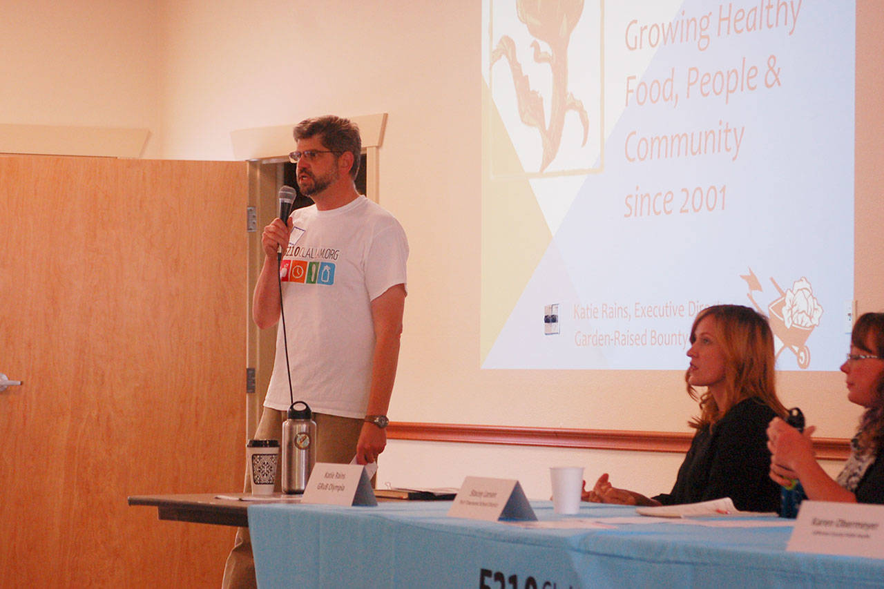 Left, Clallam County Commissioner Mark Ozias opens the discussion about increasing access to healthy food at a forum facilitated by the Olympic Peninsula Healthy Community Coalition on Wednesday, Aug. 16, at the Guy Cole Center in Sequim where regional leaders across the county met to discuss health objectives for the future. Sequim Gazette photo by Erin Hawkins
