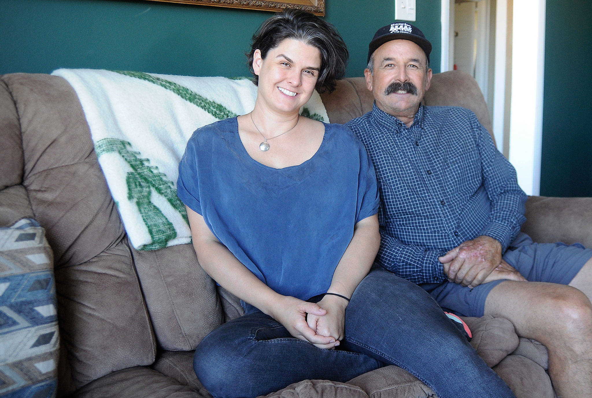 Rachel Mills joins her father Jerry Pino in his Sequim home last week. Mills and Pino for the first time earlier this year. Sequim Gazette photo by Michael Dashiell