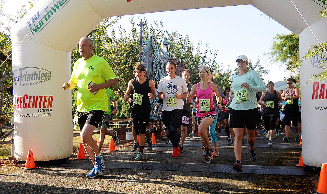 Participants break from the starting line at the 2017 Valley of Trolls half-marathon, 10k and 5k runs on Aug. 19. Sequim Gazette photo by Michael Dashiell