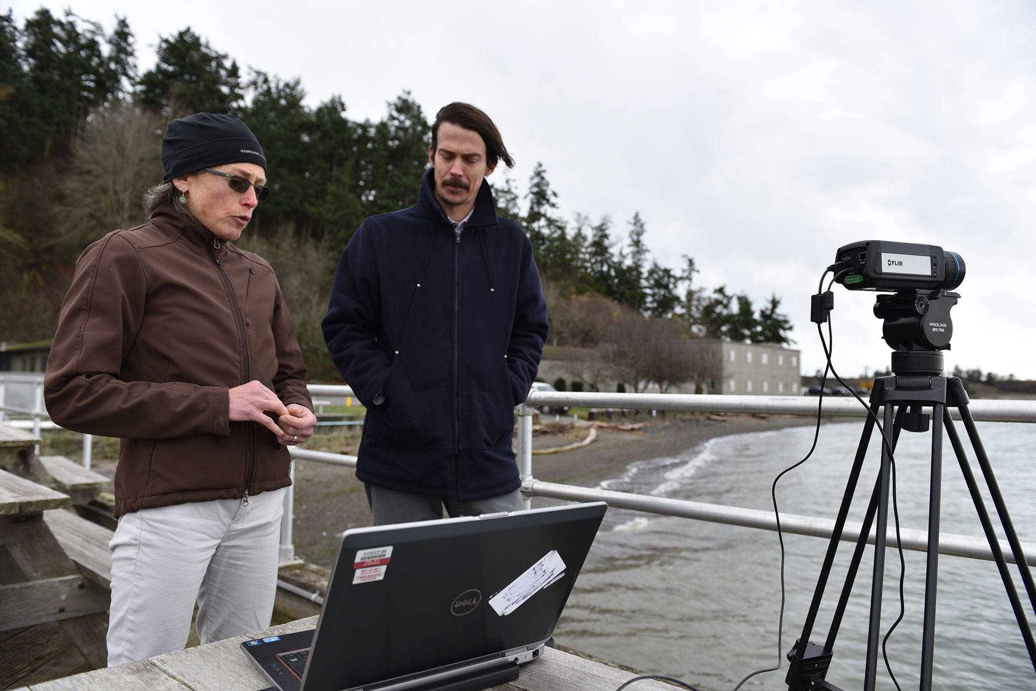 Engineers Shari Matzner and Garrett Staines with Pacific Northwest National Laboratory’s Marine Sciences Laboratory discuss their development of software that will analyze thermal video to help birds and bats co-exist with offshore wind farms. Photo by Eric Francavilla/Pacific Northwest National Laboratory