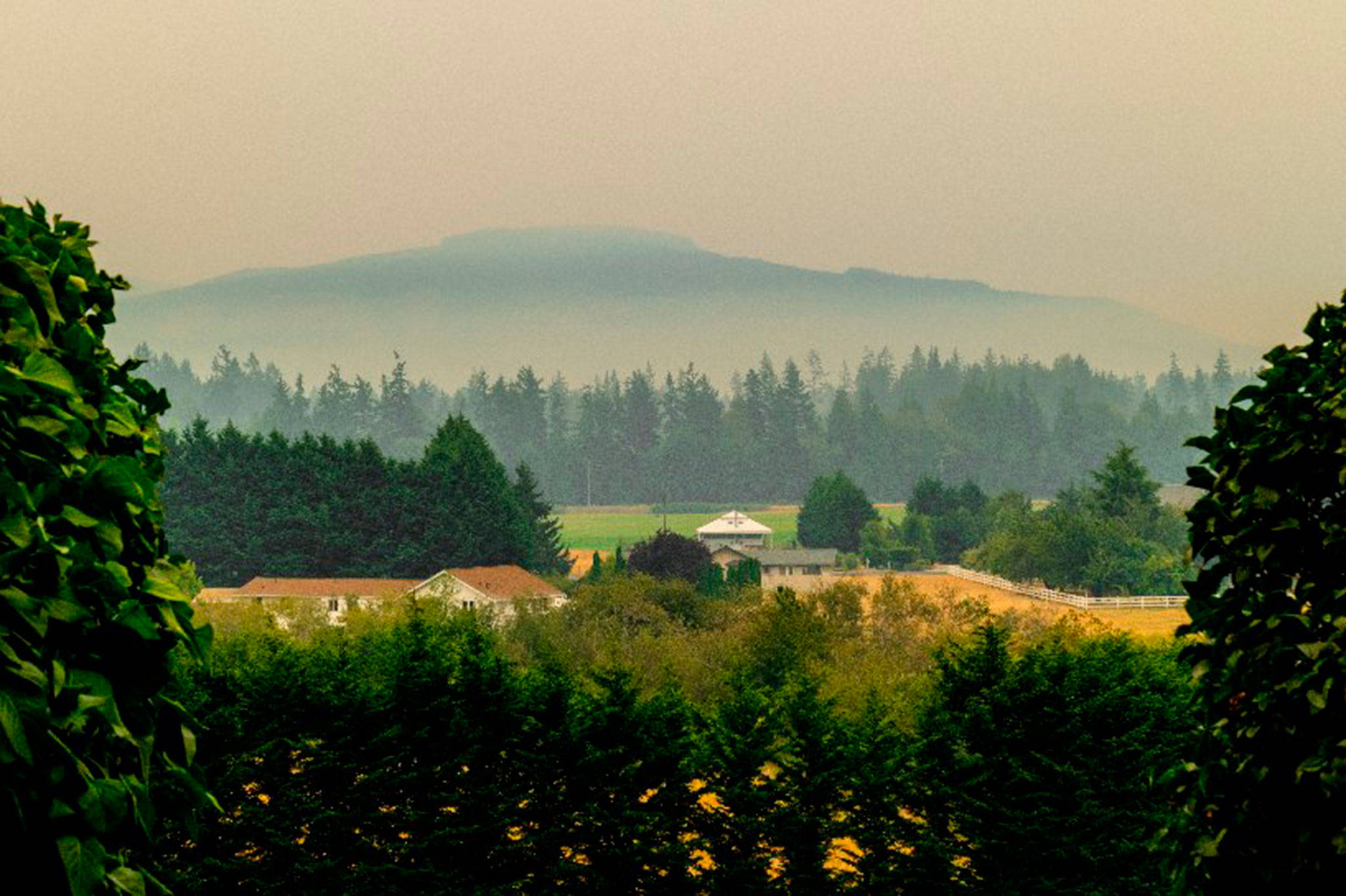 Contributor Bob Lampert captures a shot of the haze on Tuesday morning over the Sequim-Dungeness Valley as wildfires from Central Washington continue to burn. The National Weather Service reported an Air Quality Alert through 5 p.m. Wednesday.