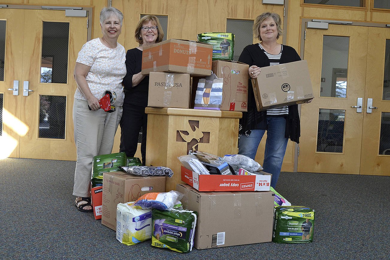 More than 1,000 new undergarments were packed and shipped to Texas as support for Hurricane Harvey victims on Sept. 11 at Dungeness Valley Lutheran Church. Volunteers, from left, Sue Brock, Kathy Lohrman and Andra Smith, helped lead the effort with an “Undie Sunday” donation drive the day before at the church. Sequim Gazette photo by Matthew Nash