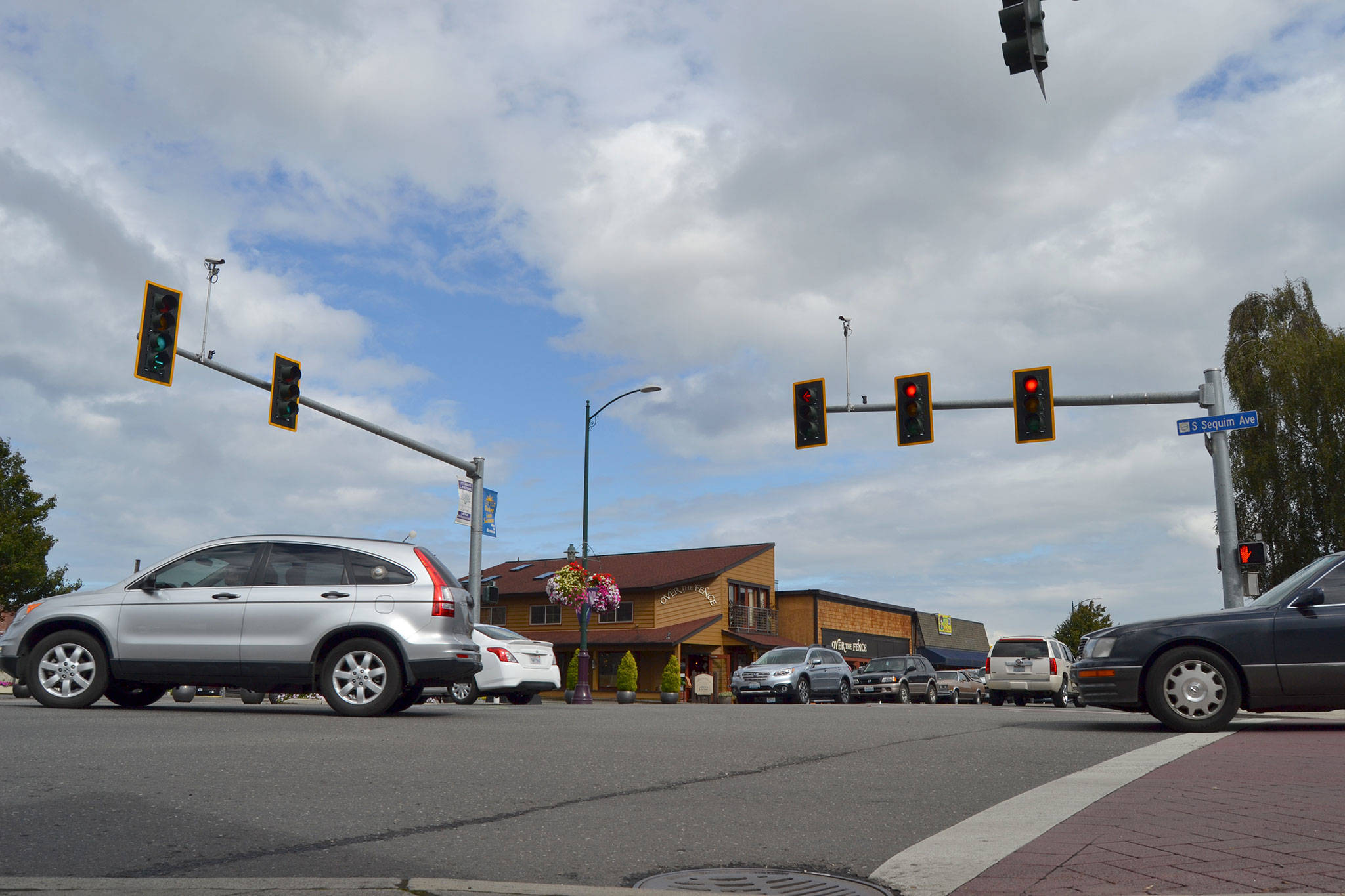 Within the next year, staff with the City of Sequim plan to install flashing yellow lights in left-turn lanes at the Sequim Avenue/Washington Street intersection to help flow traffic more east-west. By installing that and making a few other changes, city staff anticipate lowering the average wait time to turn left by more than 20 seconds. Sequim Gazette photo by Matthew Nash