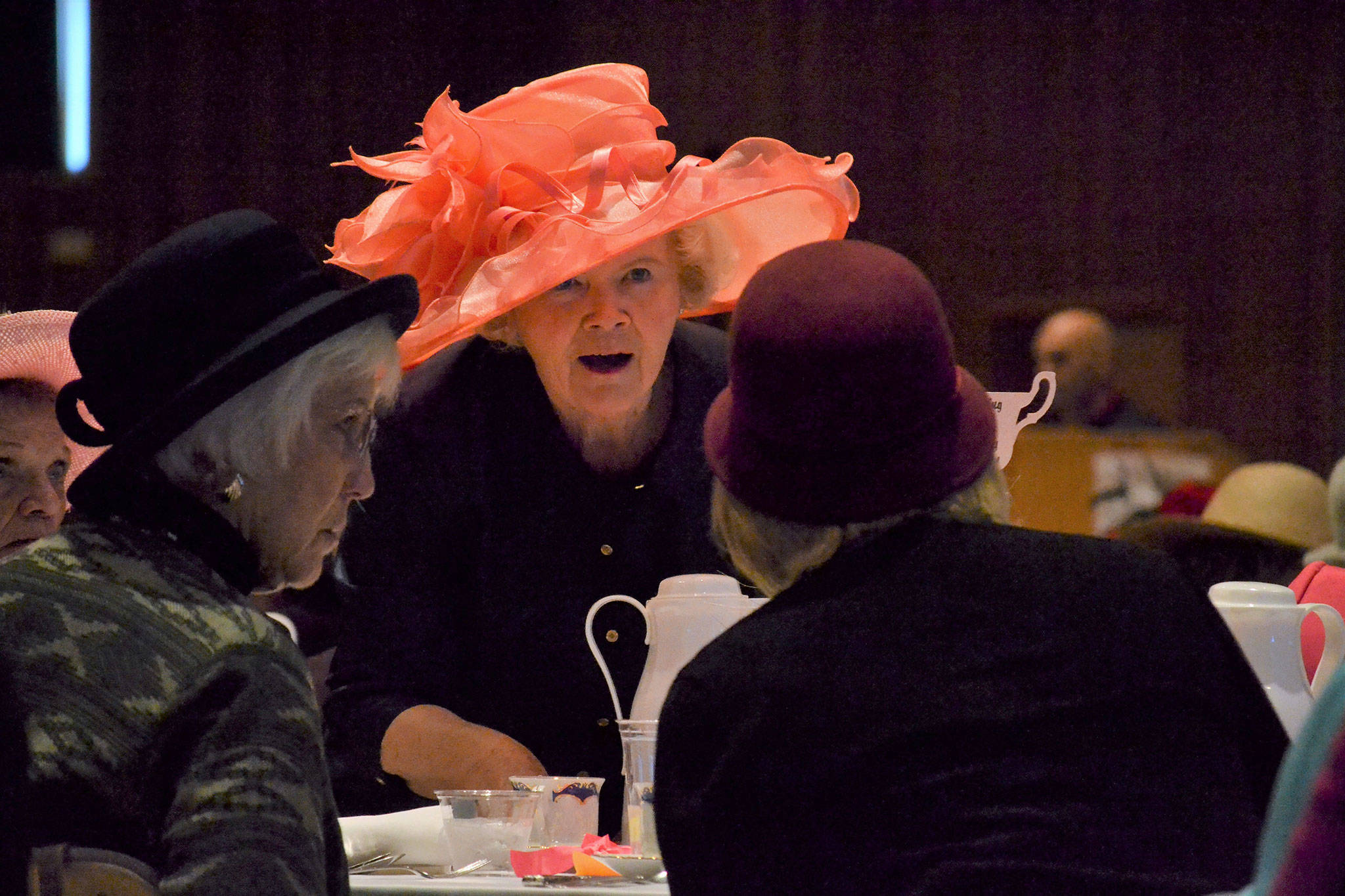 Shirley Sutterlin serves water to Evelyn and Sandy Bequette at the Mad Hatter’s Tea. Sutterlin has attended each tea and Sandy for 19 years saying she appreciates the “closeness, the friendliness” of attendees and that “they all look out for each other.” Sequim Gazette photos by Matthew Nash