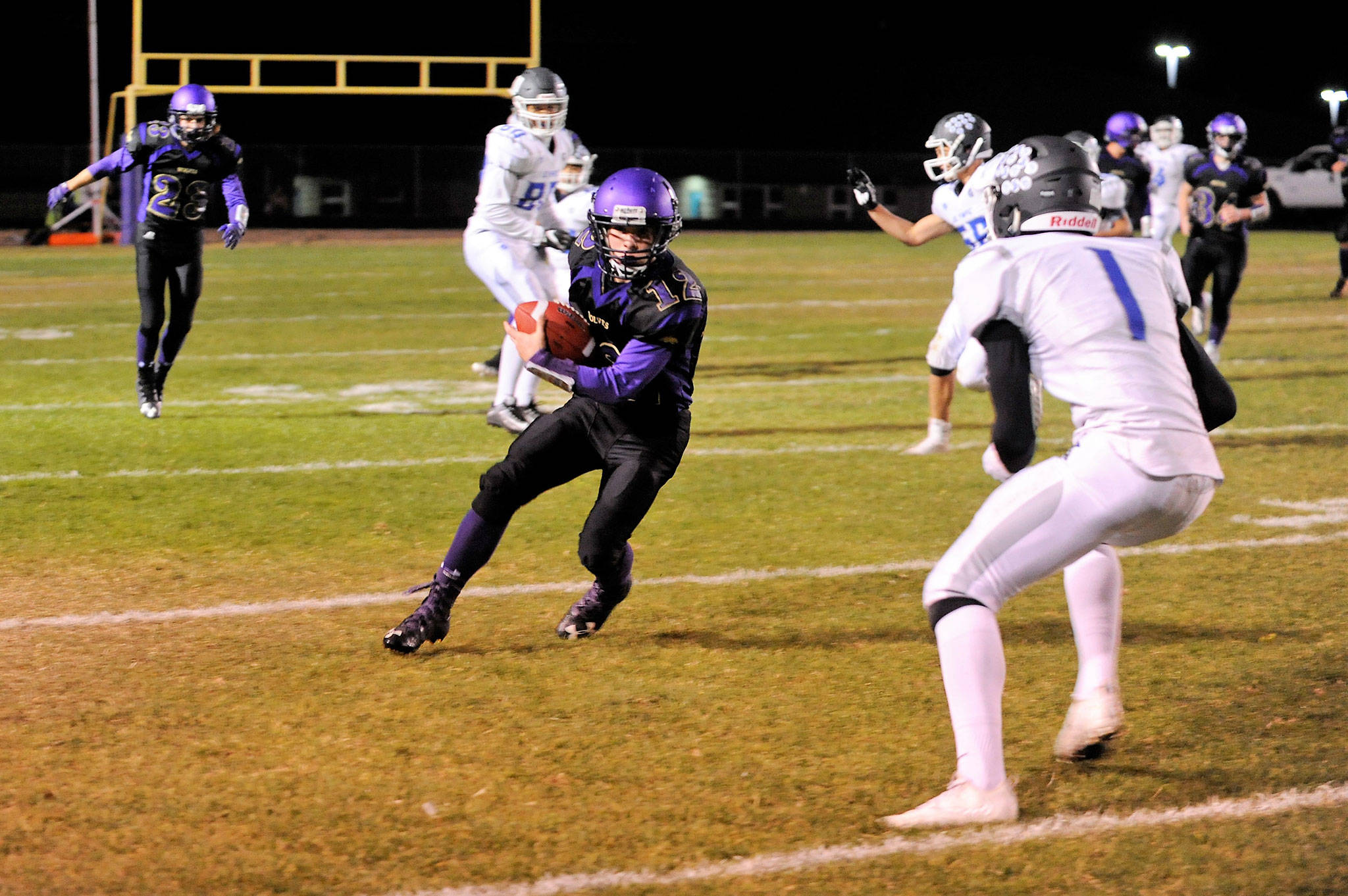 Sequim’s Kyler Rollness , left, makes a catch for a first down in the red zone against Olympic setting up a touchdown by Gavin Velarde in the third quarter. Sequim Gazette photo by Matthew Nash