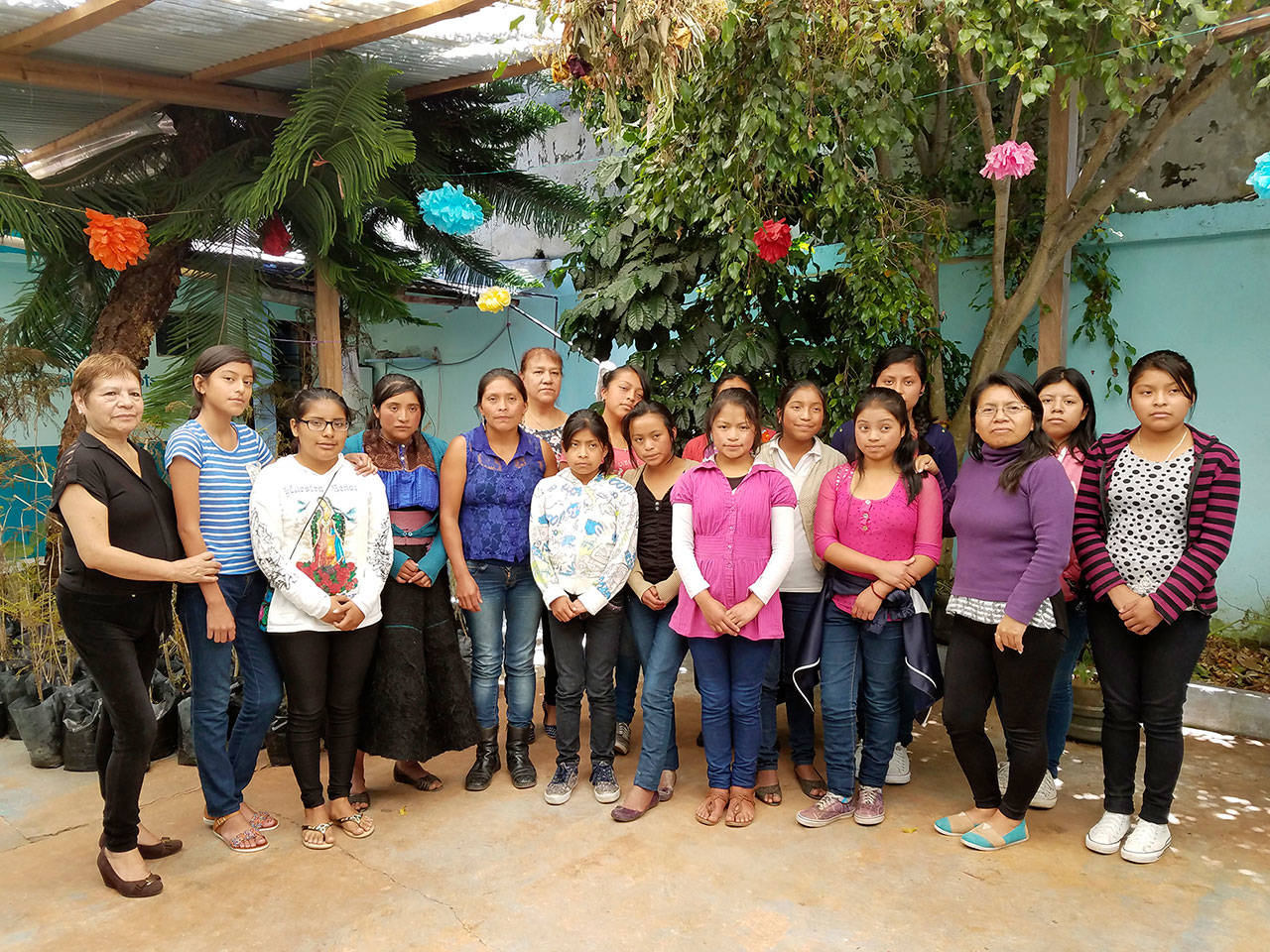 Current scholarship recipients of Mujeres de Maíz Opportunity Foundation stand for a group photograph. (Judith Pasco)