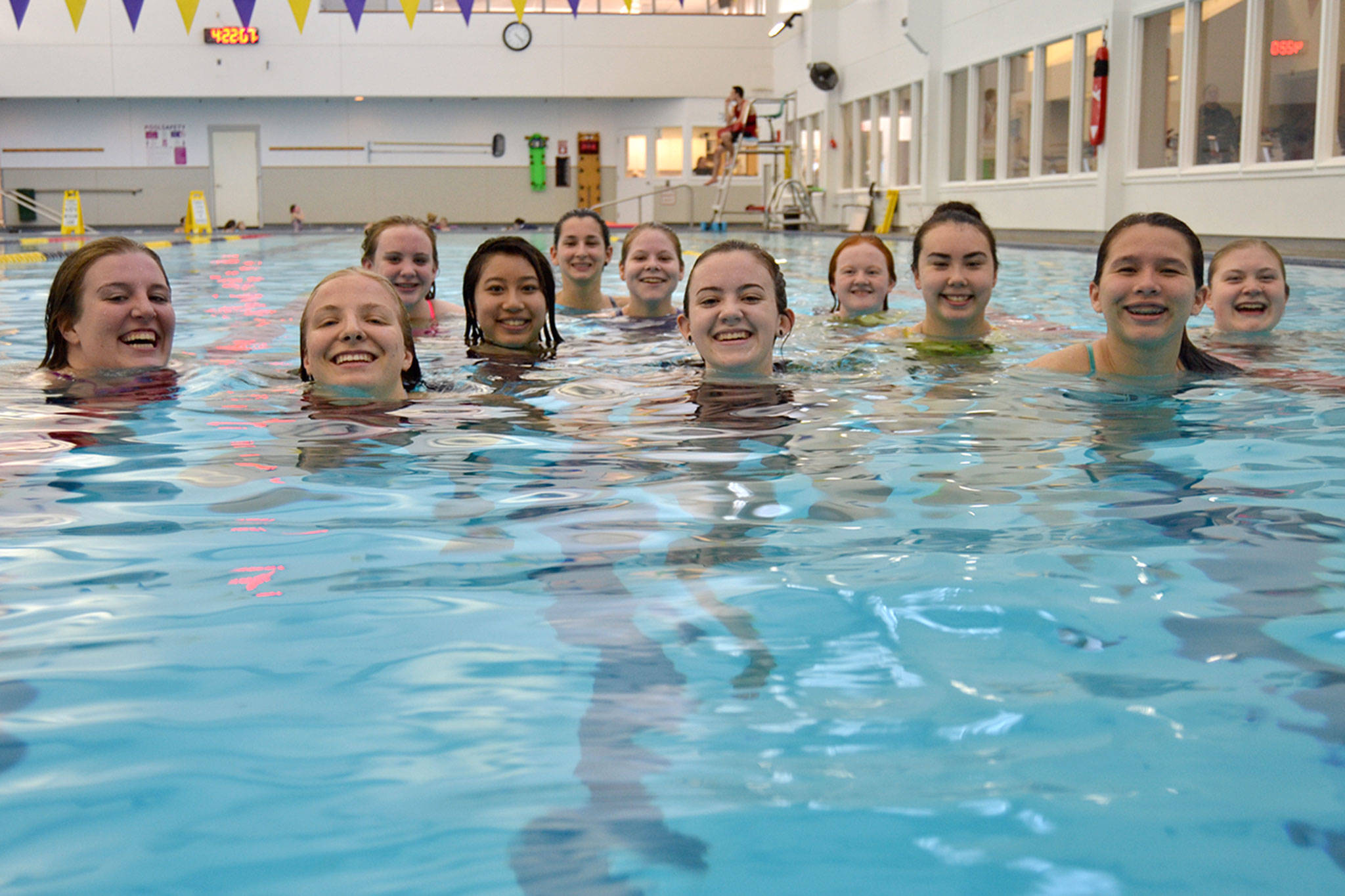 Swimmers competing at the 2A district meet include, from left, Amanda Murphy, Annabelle Armstrong, Chloe McKay, Jasmine Itti, Irene Stello, Morgan Cariou, Sydney Swanson, Heidi Schmitt, Sydnee Linnane, Sonja Govertsen, and Claire Cronin. Not Pictured are Aleah Chen and Eislynn Flood. Sequim Gazette photo by Matthew Nash