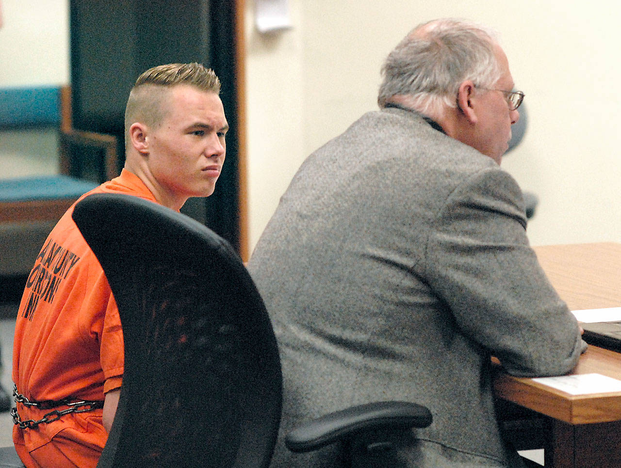 Benjamin Bonner looks at defense attorney Harry Gasnick during Bonner’s first appearance in Clallam County Superior Court in May. (Keith Thorpe/Peninsula Daily News)