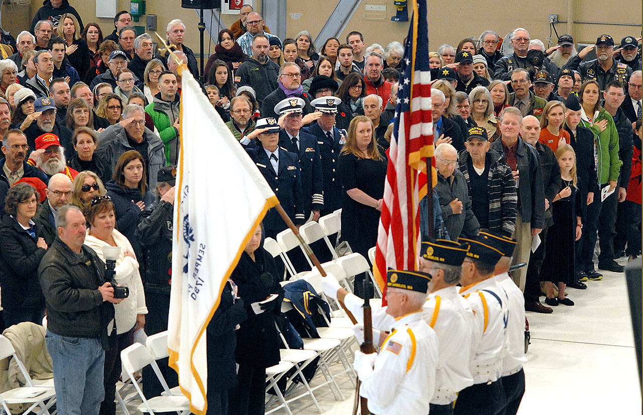 A color guard from American Legion Post 29 of Port Angeles presents the flags of the U.S. Coast Guard and of the United States at Saturday’s Veterans Day Ceremony at the U.S. Coast Guard Air Station/Sector Field Office Port Angeles on Ediz Hook.