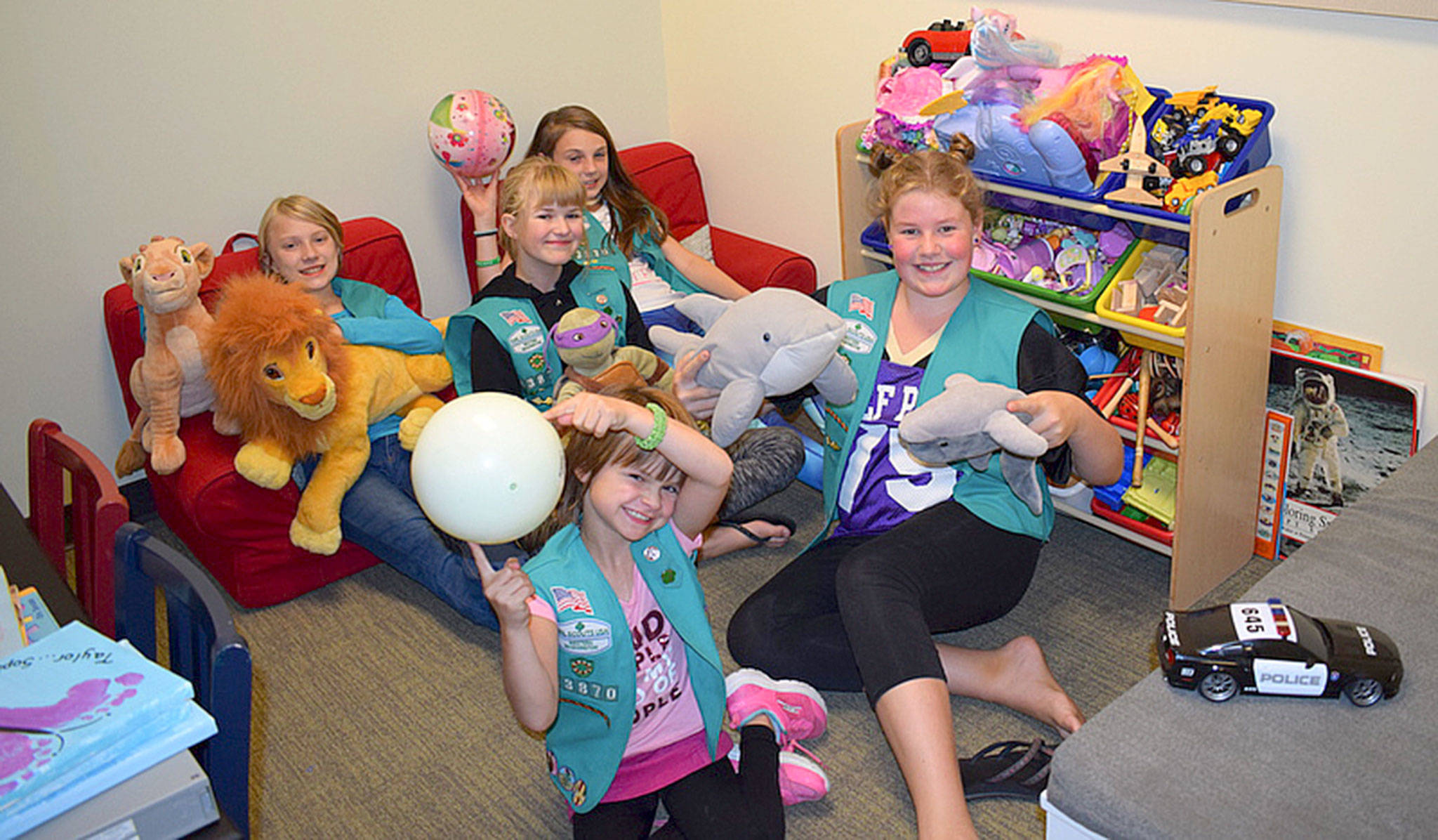 Girl Scouts with Sequim Troop 43870, from left, Johanna Beckerley-Kohl, Sophie Morton, Taylor Heyting, Caydence Barnett, and Paige Krzyworz, take a moment for a photo-op as they remodel the child-friendly space in the Sequim Police Department called Cozy Cove. Photos courtesy of Heidi Krzyworz