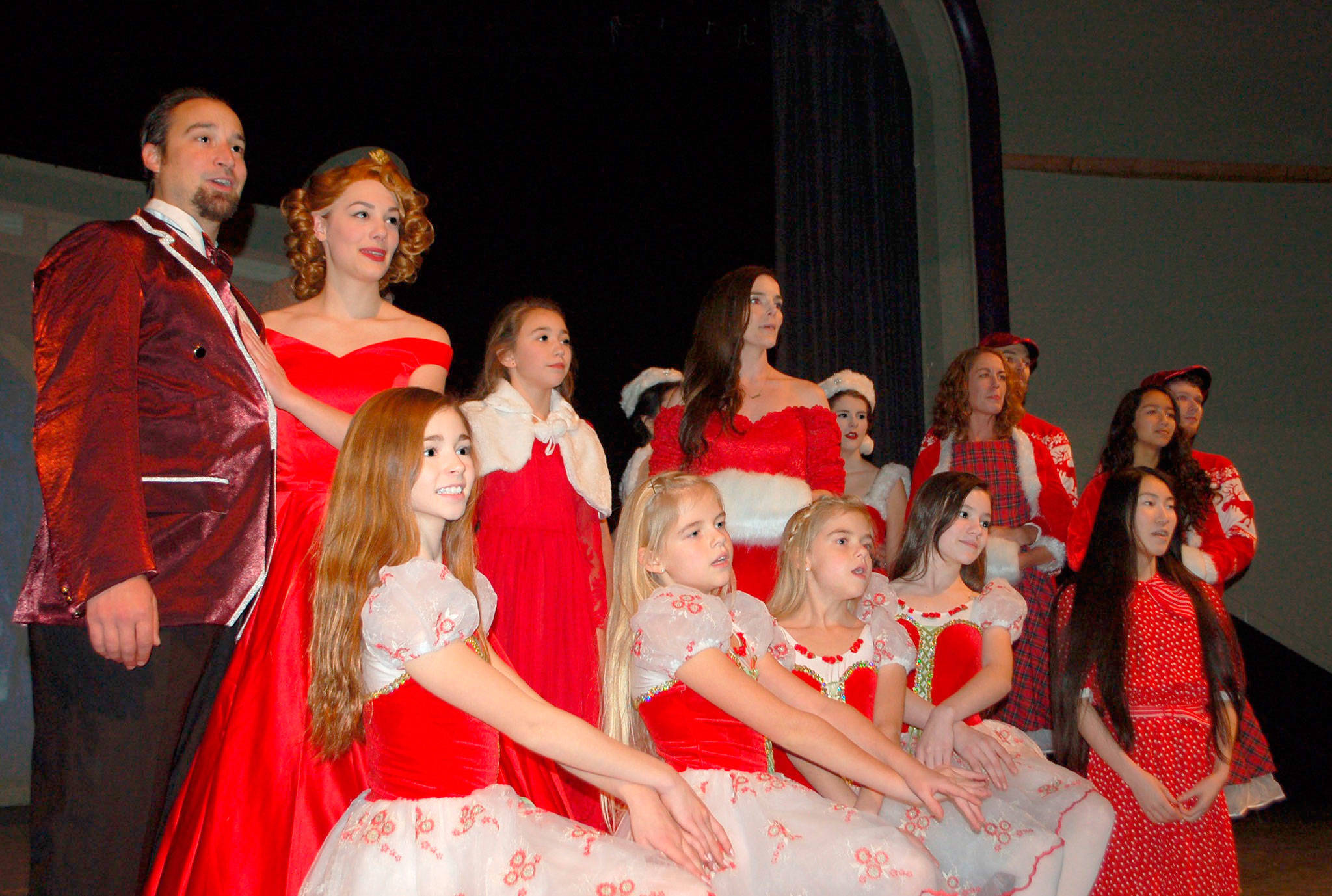 The cast of “Irving Berlin’s White Christmas” from back left, Jeremy Pederson, Danielle Lorentzen, Flora Sullivan, Kate Long, Ali Cobb, Kayla Oakes, Noah Long, Isabella Knott and Quinton Cornell, and front left, Ava Johnson, Selah and Aria Turrey, Courtney Smith and Meiqi Liang rehearse one of the scenes from the musical that will play at the Sequim High School Theater starting Dec. 7. Sequim Gazette photo by Erin Hawkins