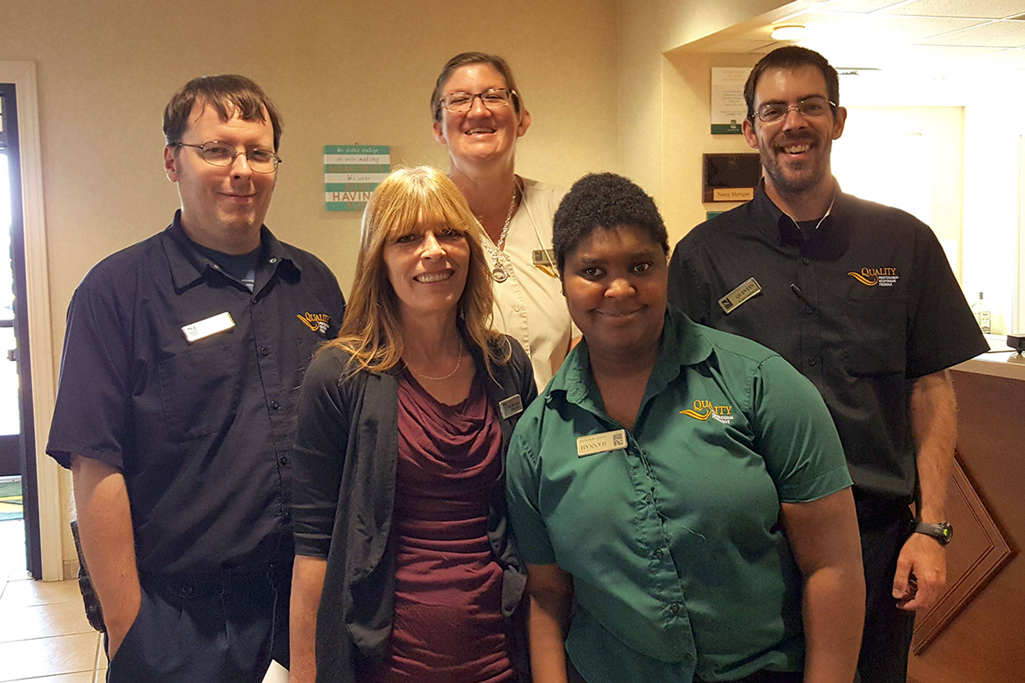 Employees with Morningside Services of Port Angeles and Quality Inn and Suites in Sequim celebrate working together for two years. Submitted photo