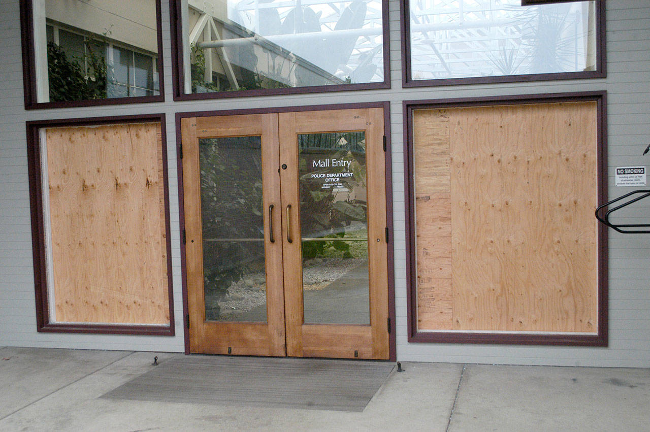 The damaged north entrance to Port Angeles City Hall is shown Saturday, Dec. 2. Police said Wesley Alcorn threw landscaping rocks into the windows. Photo by Rob Ollikainen/Peninsula Daily News