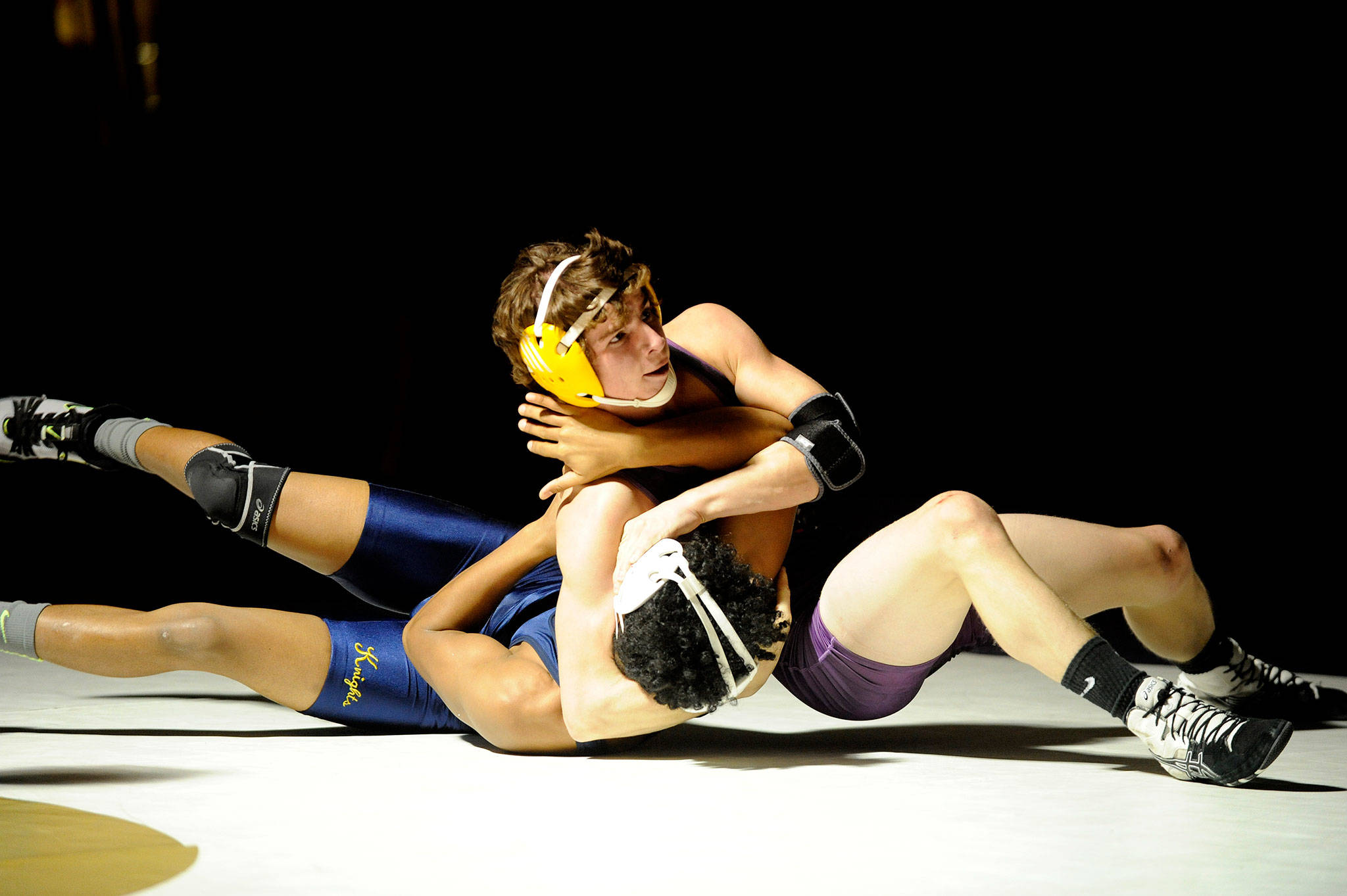 Sequim’s Jamie Schroepfer attempts to pin Bremerton’s Alpha Cooper in the Wolves’ first dual meet. Schroepfer went on to pin him with less than 10 seconds left in the first period on Dec. 5. Sequim Gazette photos by Matthew Nash