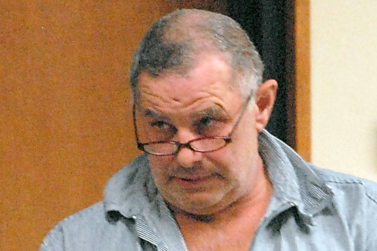 Keith Thorpe/Peninsula Daily News Roger Garman of Sequim enters Clallam County Superior Court in Port Angeles on Tuesday in connection with alleged threats made to a Jamestown S’Klallam school bus driver and the tribal office.