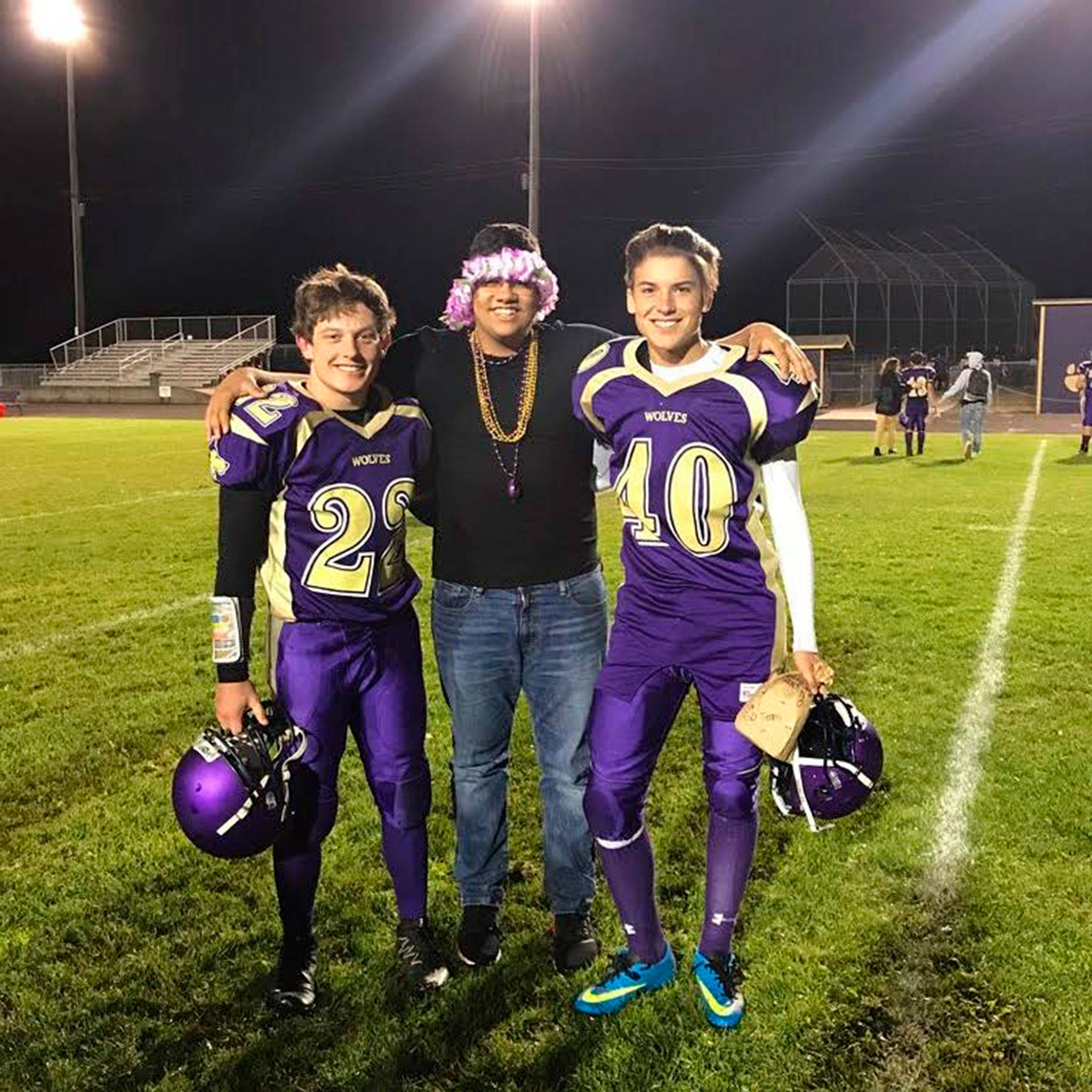 Exchange student Hayuk Minano, right, stands with friends Hayden Gresli, left, and Yussef Awawda during football season at Sequim High School. Submitted photo