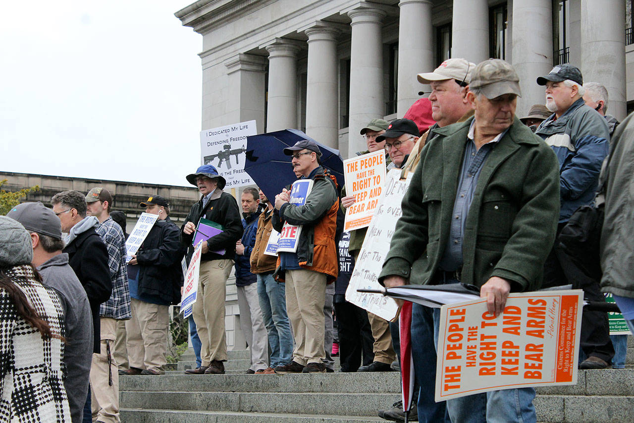 Gun rights supporters gathered on the steps of the Capitol building for a rally Friday. (Taylor McAvoy/WNPA Olympia News Bureau)