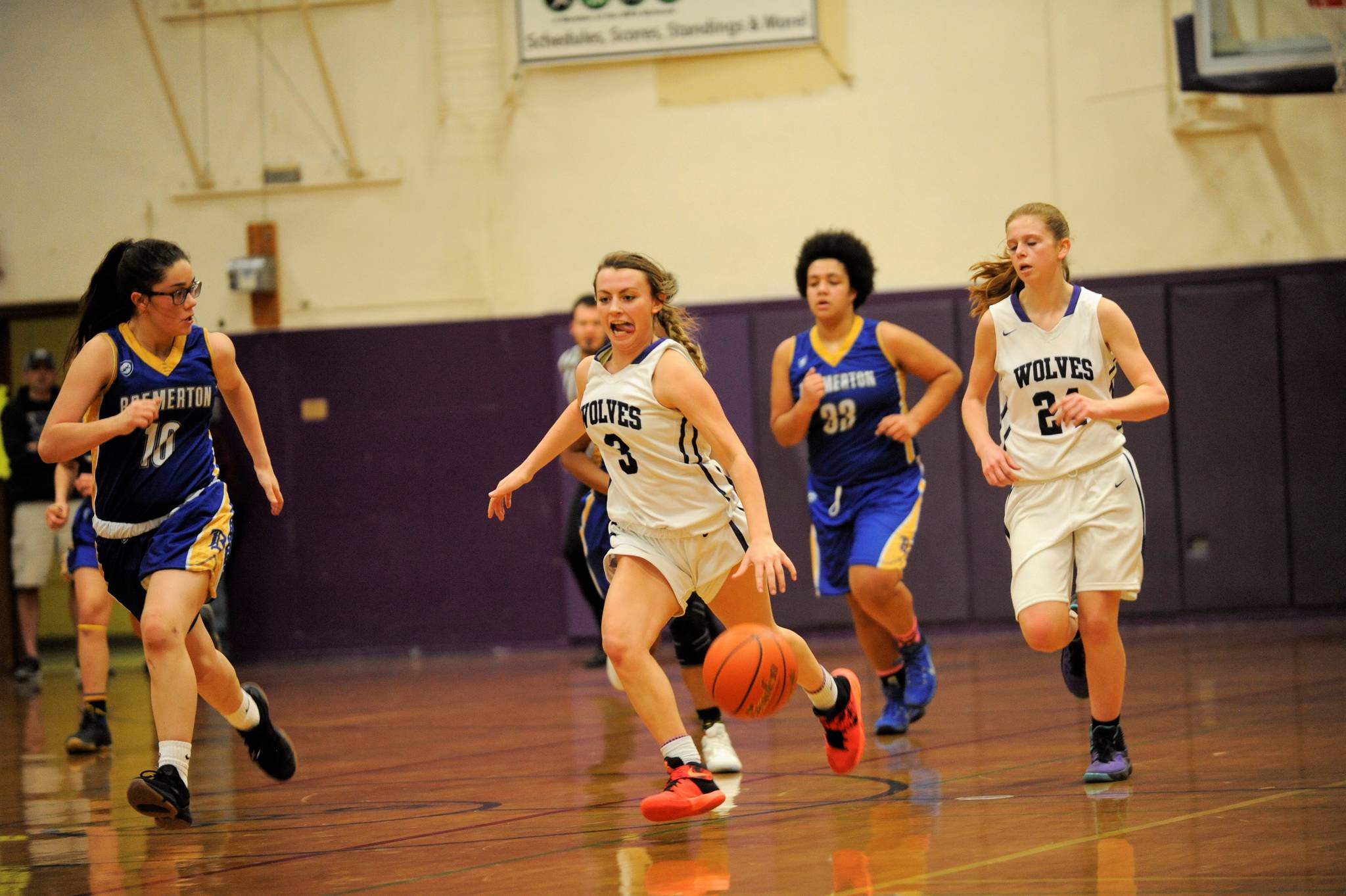 Sequim point guard Bobbi Sparks runs on a fast break past Bremerton defenders on Jan. 19. Sparks finished with nine points and had two steals in the 54-26 win. Sequim Gazette photo by Matthew Nash