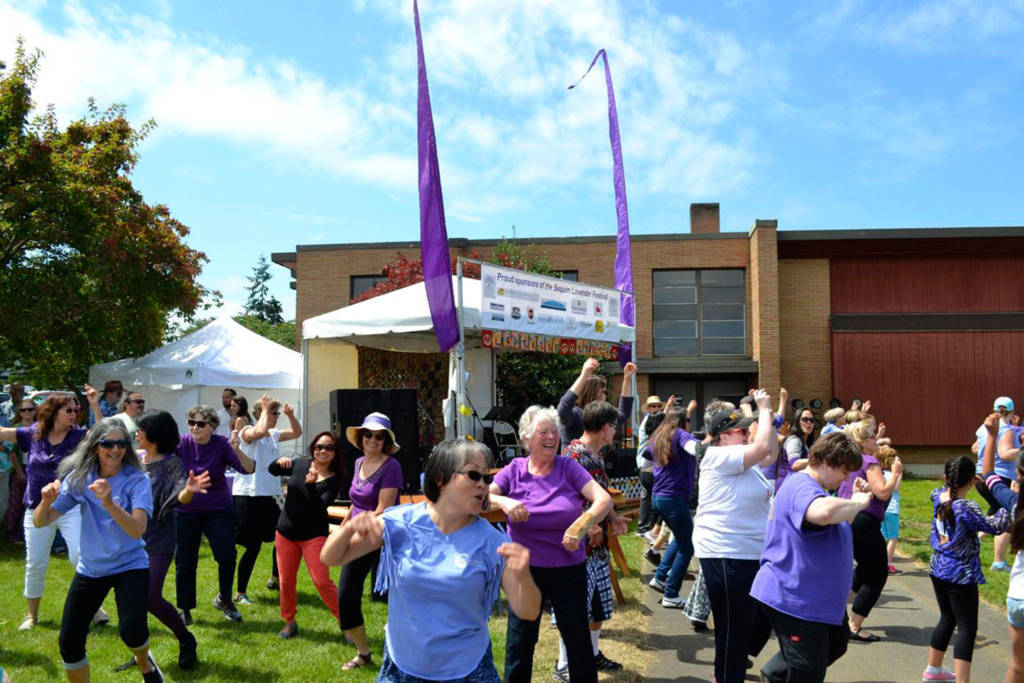 This summer, participants like these dancers seen surprising the crowd with a flash mob at the 2016 Sequim Lavender Festival Street Fair, temporarily move festivities to Carrie Blake Community Park despite construction on Fir Street being moved from this summer to early 2019. Organizers said they’ve done too much work to move the event back to Fir Street. Sequim Gazette file photo by Matthew Nash