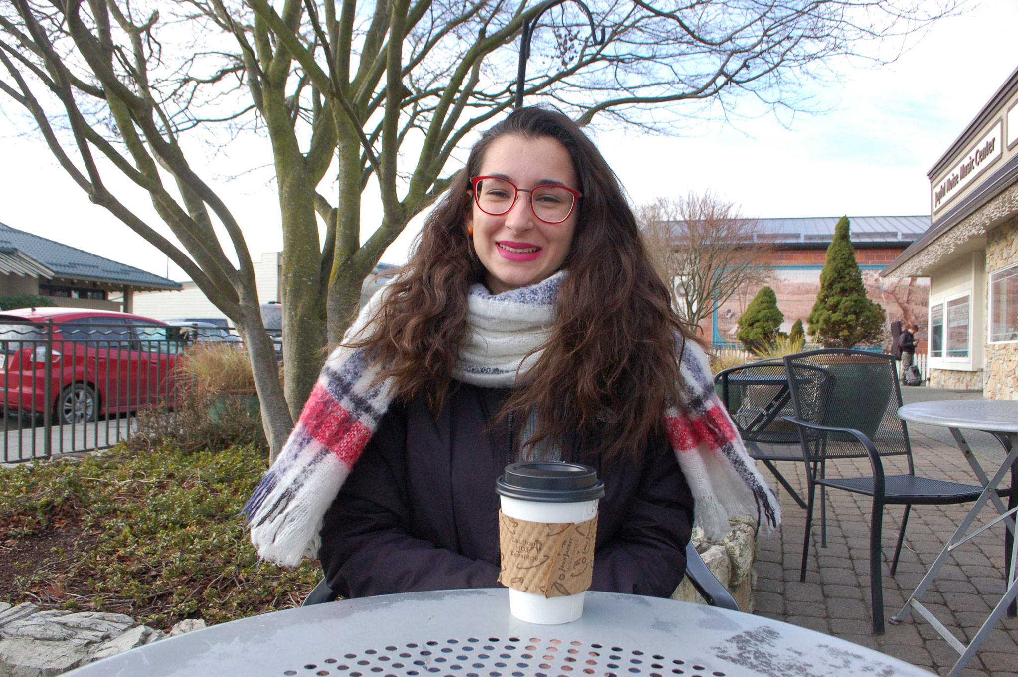 Irene Stello sits outside Hurricane Coffee shop in Sequim reflecting on some of the experiences from her first five months as an Italian exchange student attending Sequim High School.                                 Sequim Gazette photo by Erin Hawkins