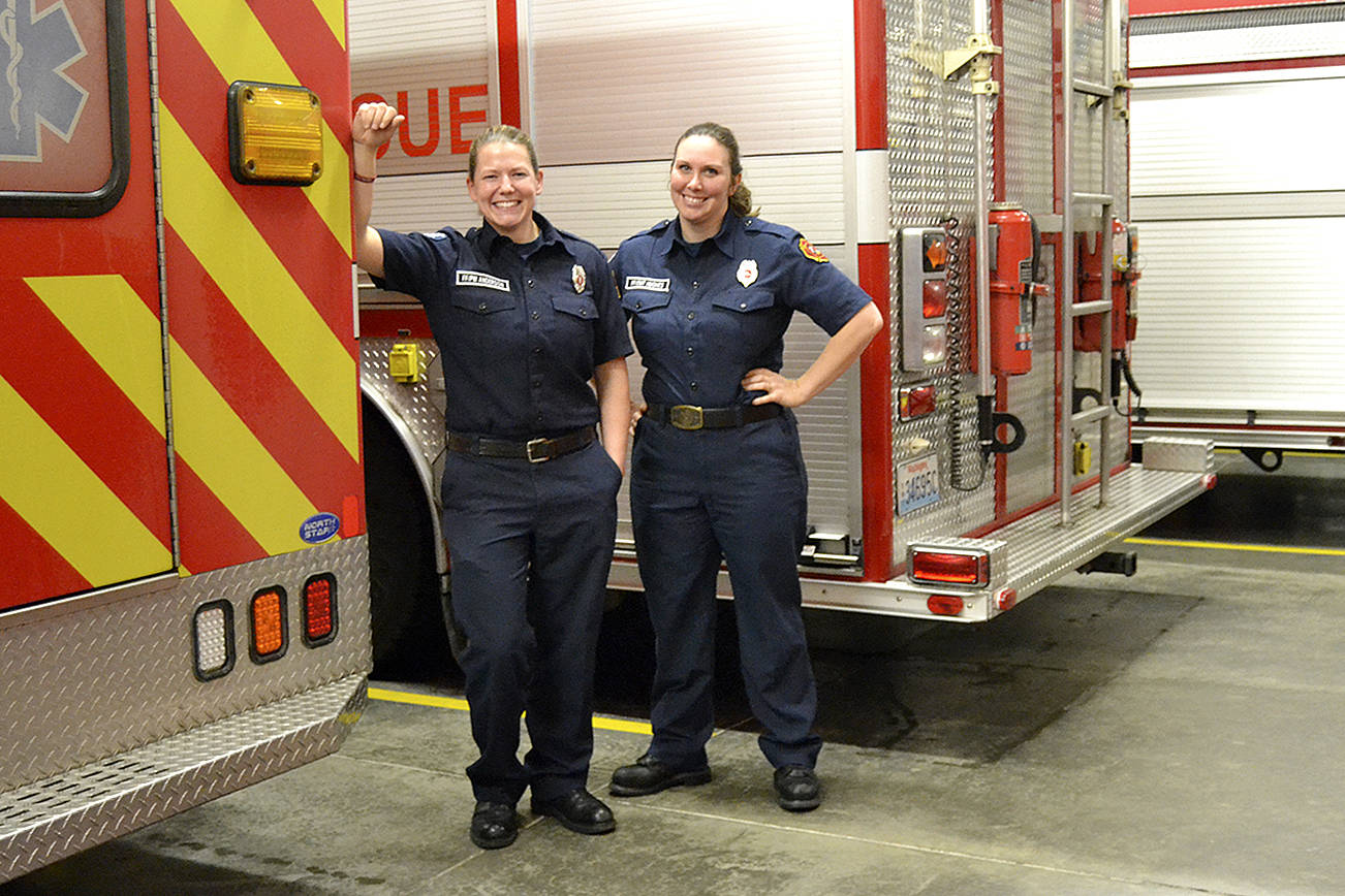 In January, career and volunteer firefighters selected Stefanie Anderson, left, and Anaka Hughes as Clallam County Fire District 3’s Career Firefighter and Volunteer Firefighters of 2017. Anderson started as an Explorer at age 15 and was hired full-time in 2006. Hughes became a volunteer firefighter about four years ago. Sequim Gazette photo by Matthew Nash