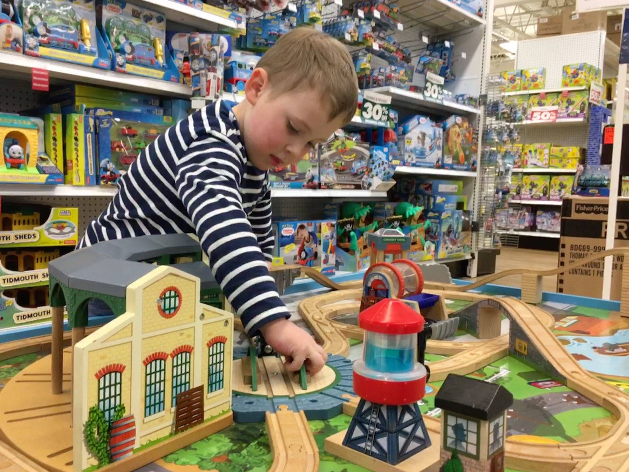 With Toys”R”Us stores set to close across the nation, the Nash family made one last trek to Sequim’s closest store stateside in Silverdale to play on the train table, look around and have fun. Sequim Gazette photos by Matthew Nash