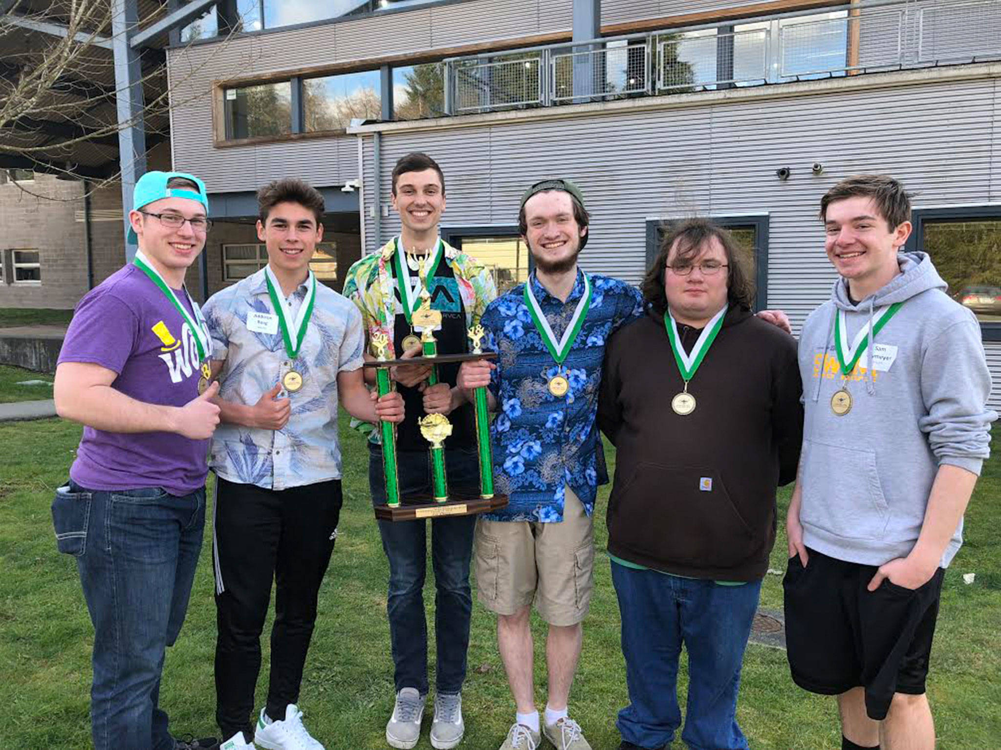 Sequim High School seniors Joe Benjamin, left, Addison Berg, Liam Stevenson, Devin Hibler, John Purvis and sophomore Sam Frymyer celebrate their win as Knowledge Bowl State Champions on March 17 at Arlington High School. Submitted photo