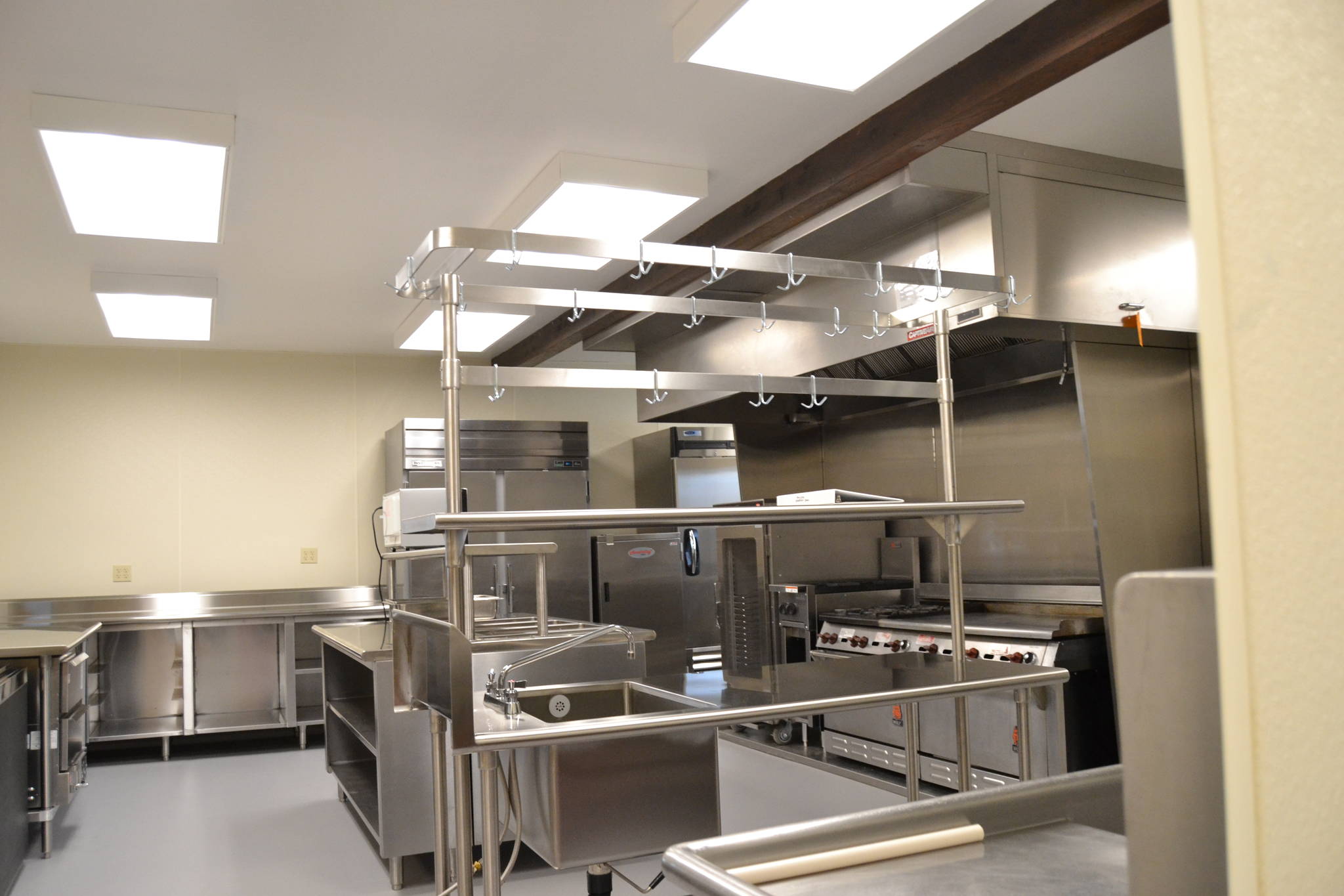 Work to refurbish the Guy Cole Events Center’s kitchen included installing a new oven hood and fire suppression system, a freezer, ice machine, lighting, and flooring along with providing electrical and plumbing hookups for future items. Sequim Gazette photo by Matthew Nash