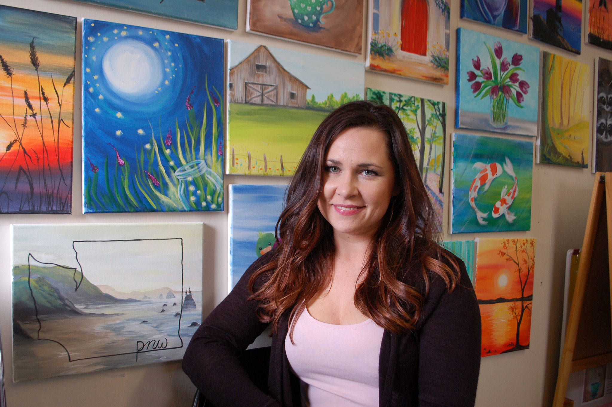 Sequim artist Natalie Martin sits in her home art studio and discusses how she aims to create both art and community together. Sequim Gazette photo by Erin Hawkins
