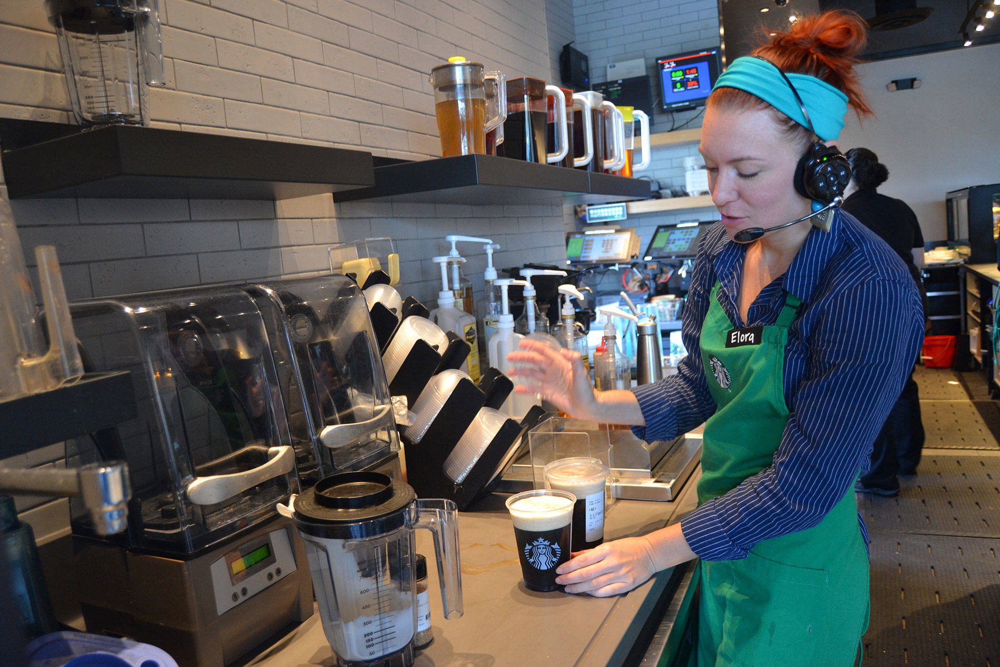 Elora Bradley readies some coffees for customers on Tuesday morning in the Sequim Starbucks.